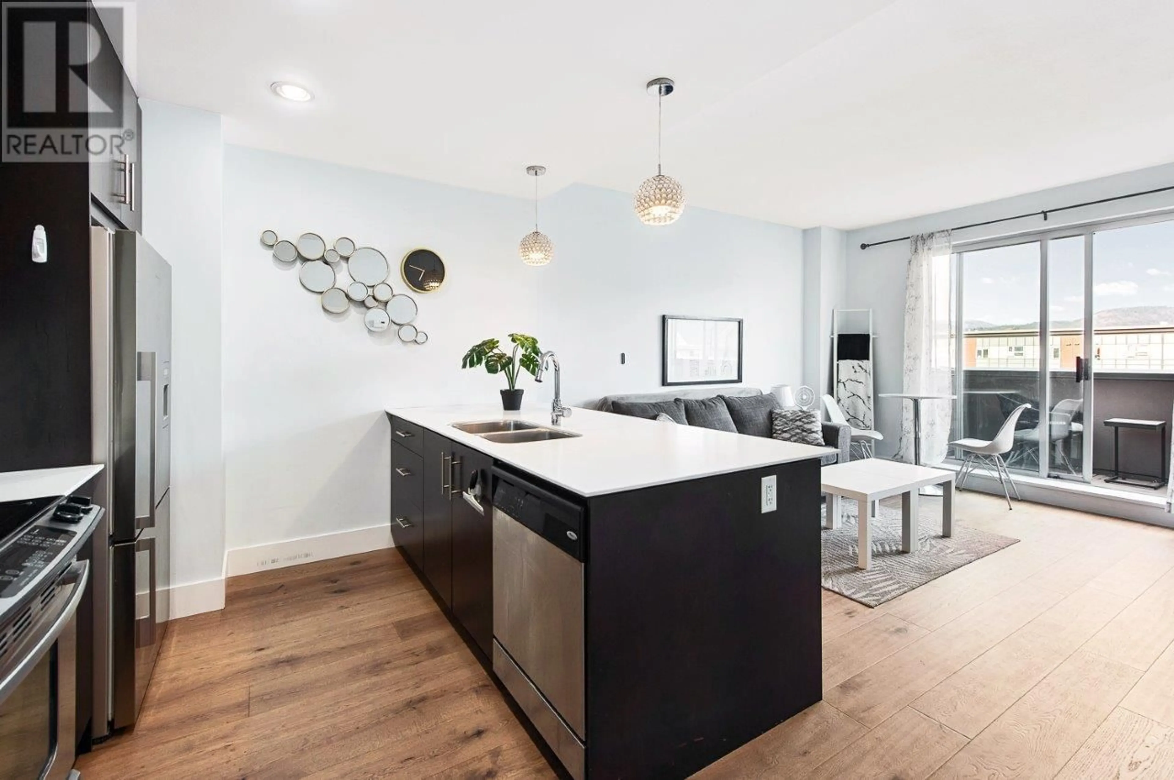 Open concept kitchen, wood/laminate floor for 307 - 2040 SPRINGFIELD ROAD, Kelowna British Columbia V1Y9N7