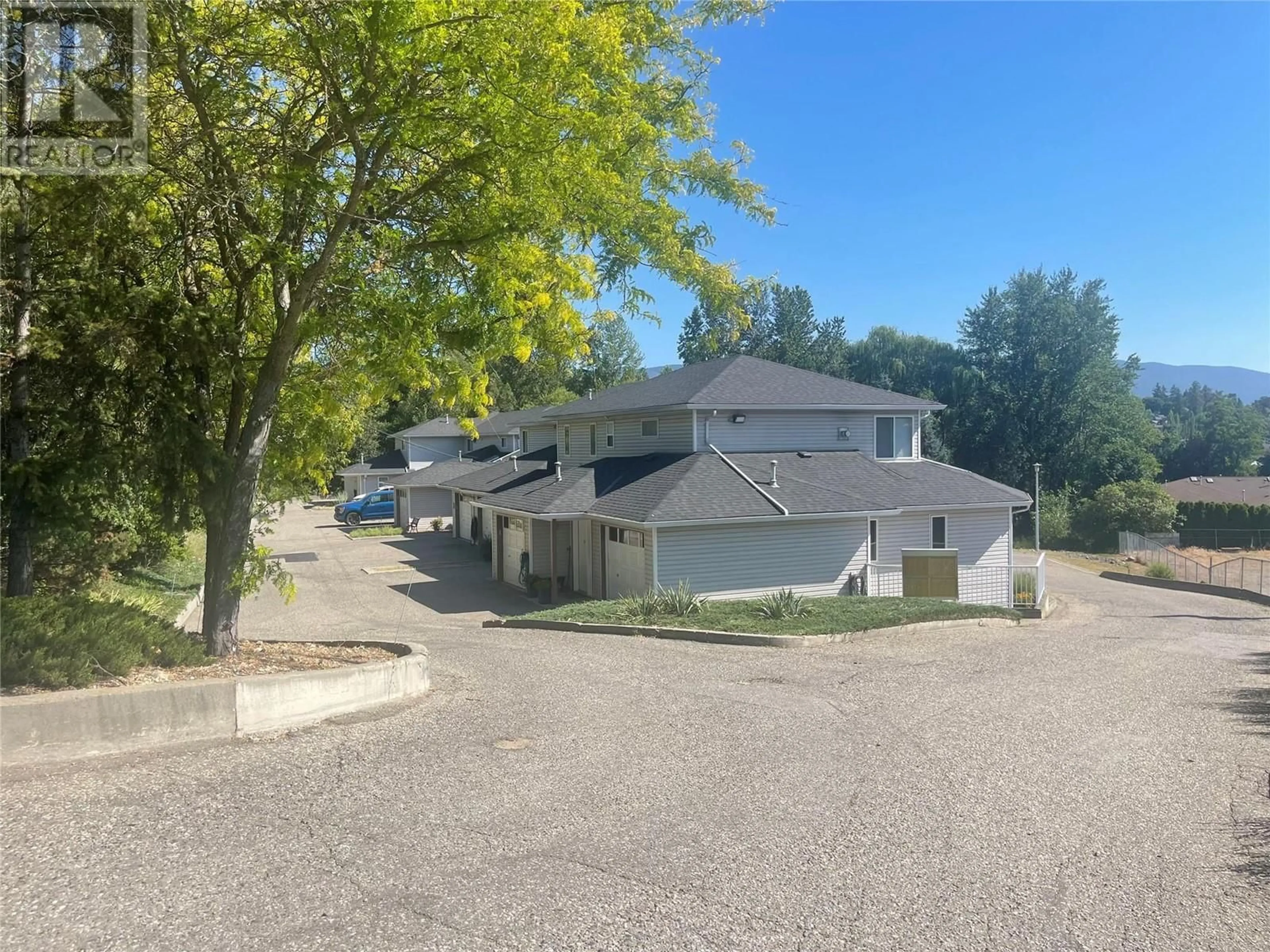 A pic from outside/outdoor area/front of a property/back of a property/a pic from drone, street for 13 - 4404 PLEASANT VALLEY ROAD, Vernon British Columbia V1T4M3