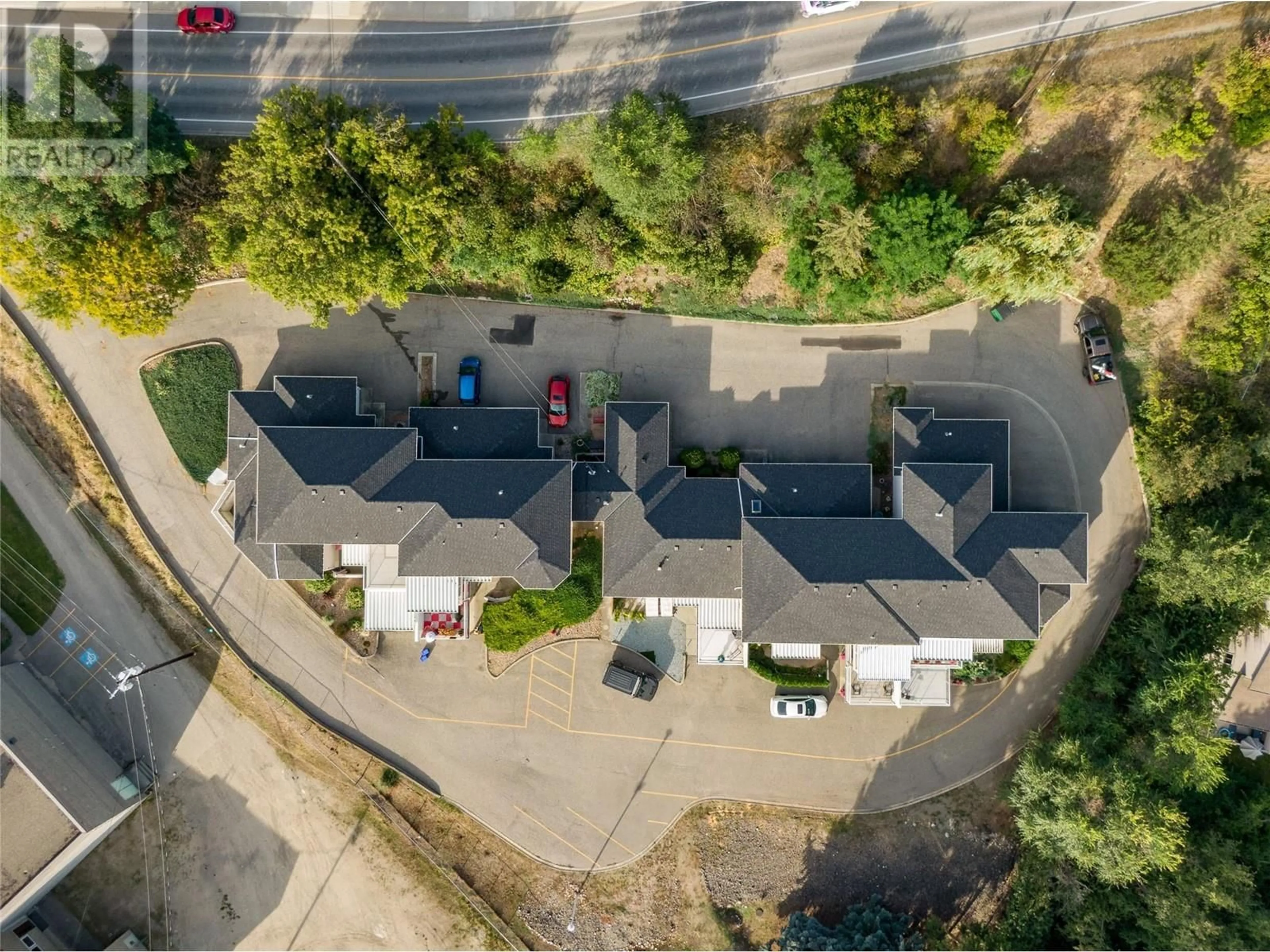 A pic from outside/outdoor area/front of a property/back of a property/a pic from drone, street for 13 - 4404 PLEASANT VALLEY ROAD, Vernon British Columbia V1T4M3