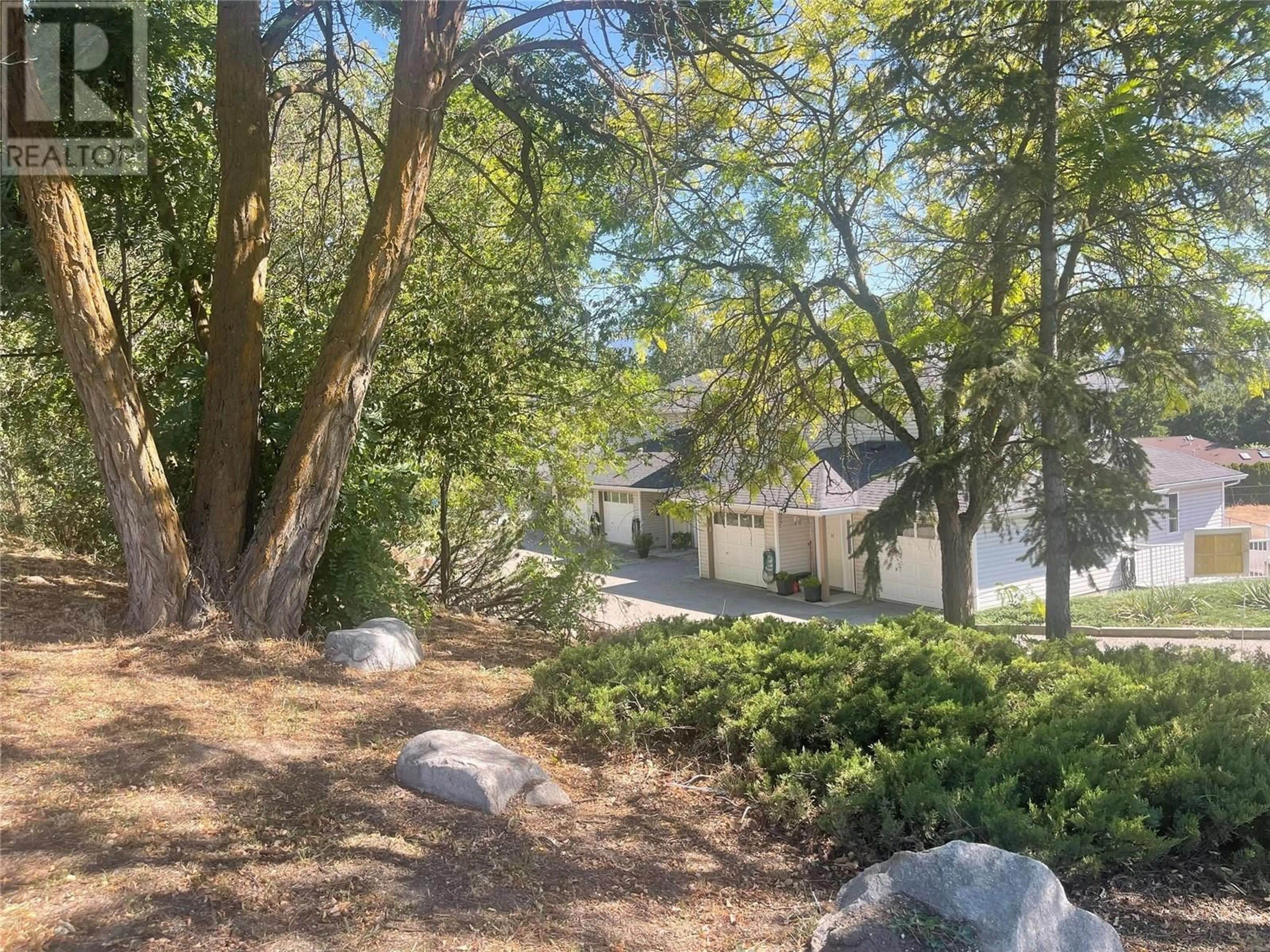 A pic from outside/outdoor area/front of a property/back of a property/a pic from drone, forest/trees view for 13 - 4404 PLEASANT VALLEY ROAD, Vernon British Columbia V1T4M3