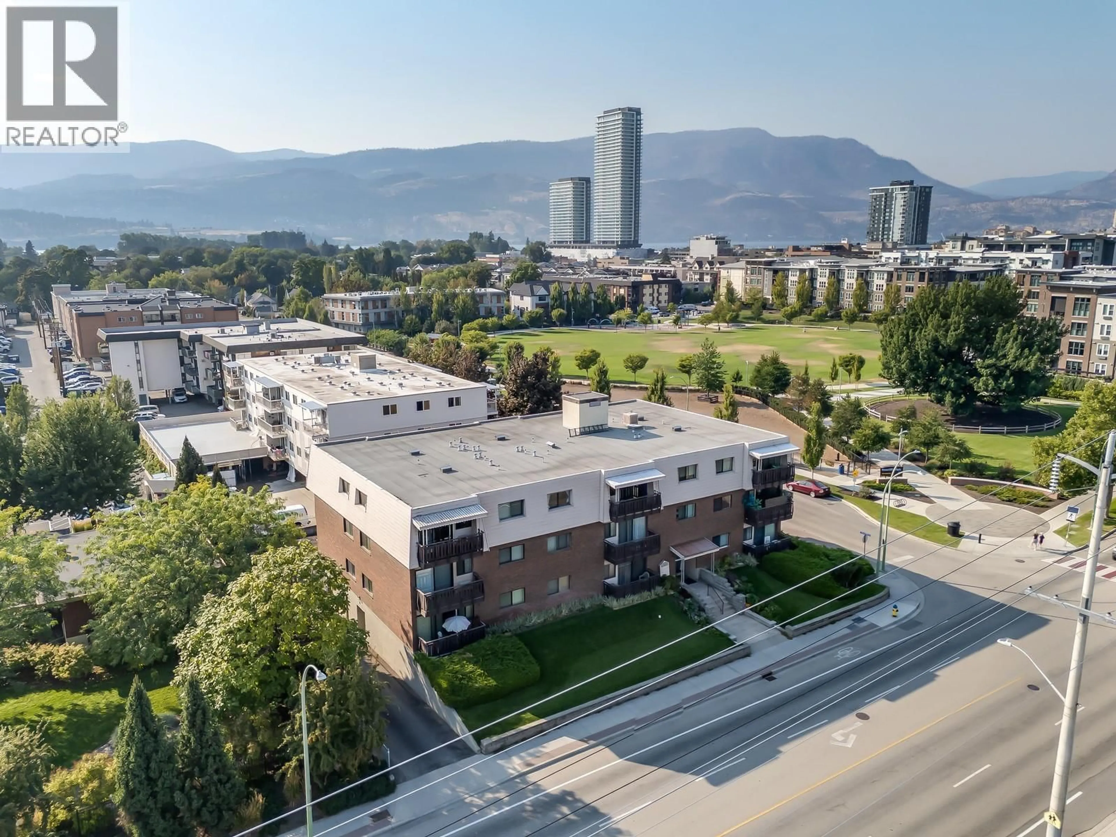 A pic from outside/outdoor area/front of a property/back of a property/a pic from drone, mountain view for 204 - 1860 RICHTER STREET, Kelowna British Columbia V1Y2M9