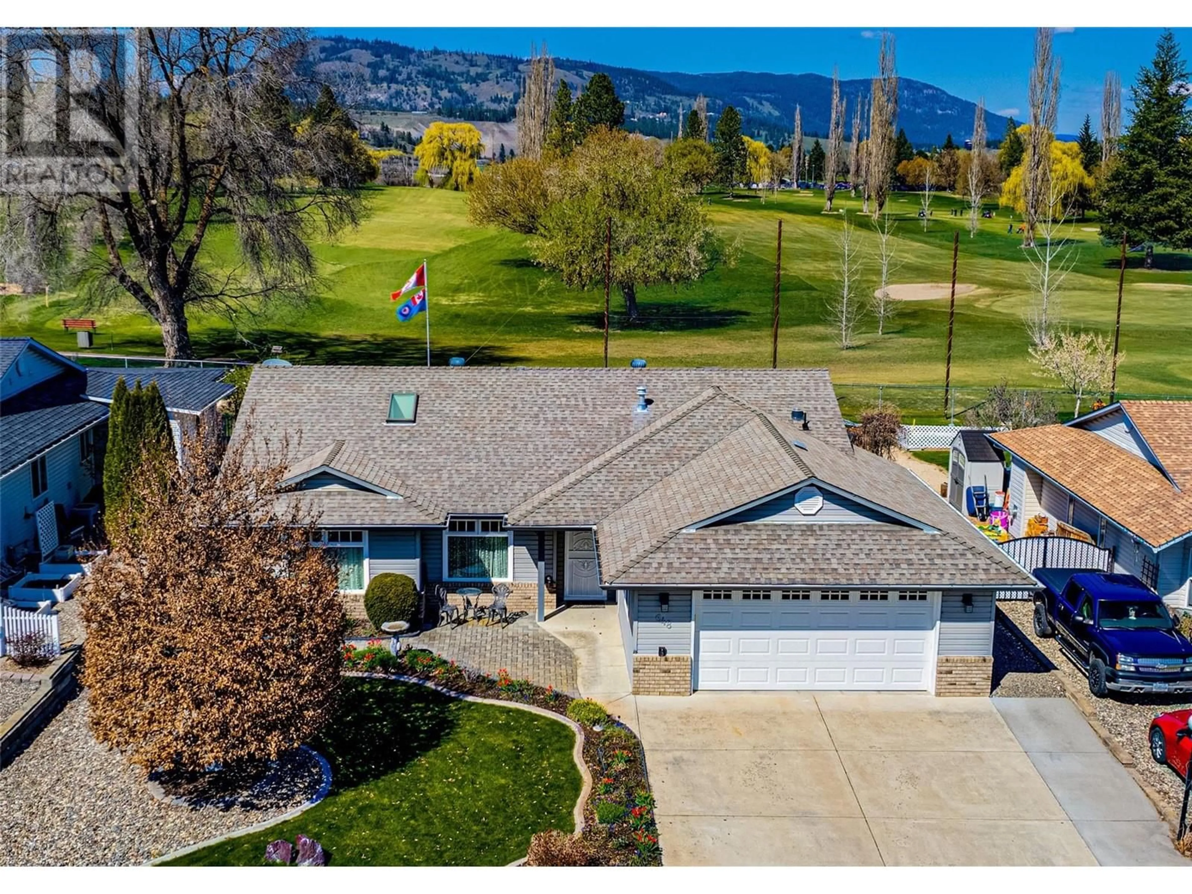 A pic from outside/outdoor area/front of a property/back of a property/a pic from drone, mountain view for 648 6TH AVENUE, Vernon British Columbia V1H1Z1