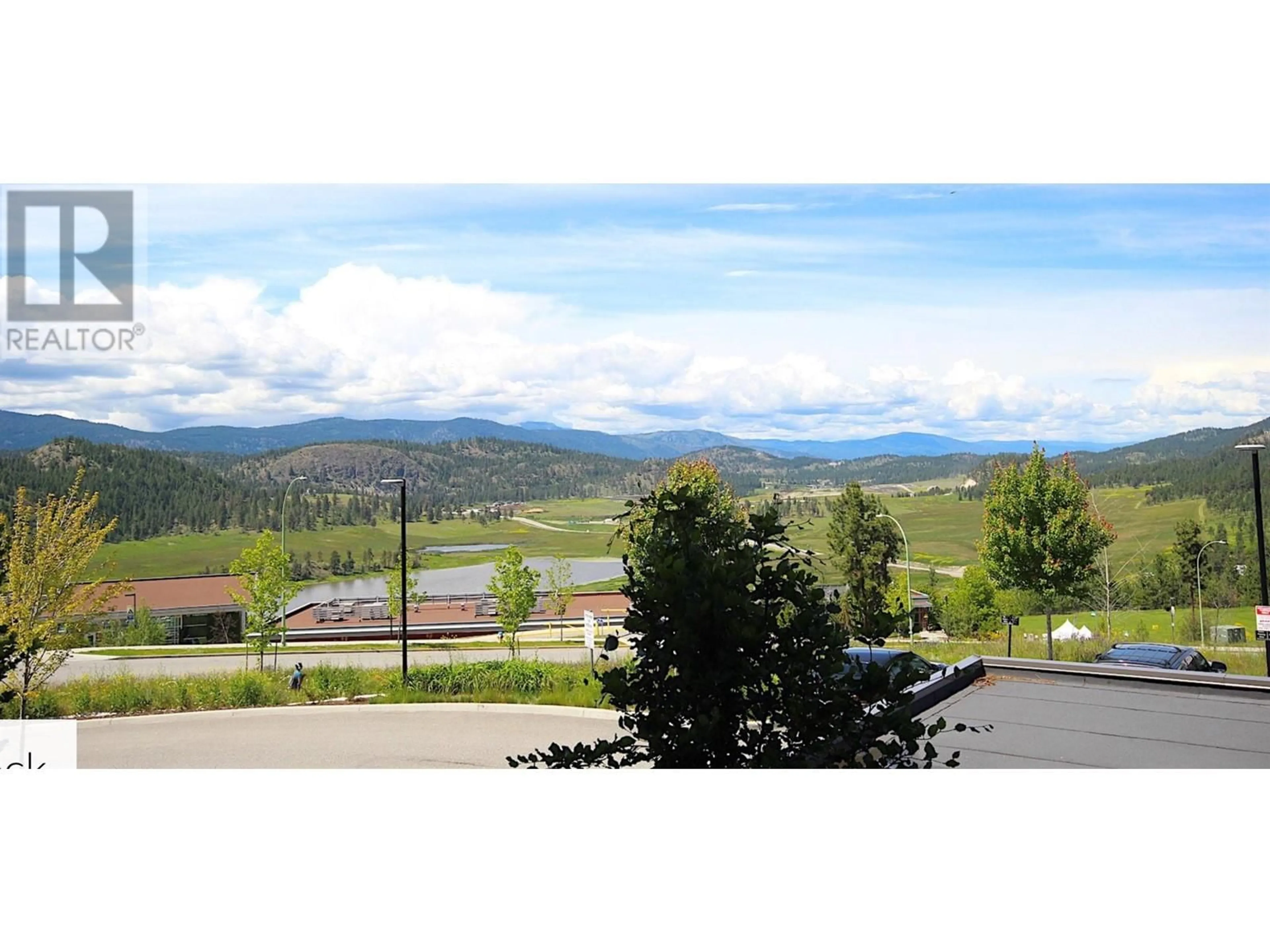 A pic from outside/outdoor area/front of a property/back of a property/a pic from drone, mountain view for 103 - 881 ACADEMY WAY, Kelowna British Columbia V1V0A2
