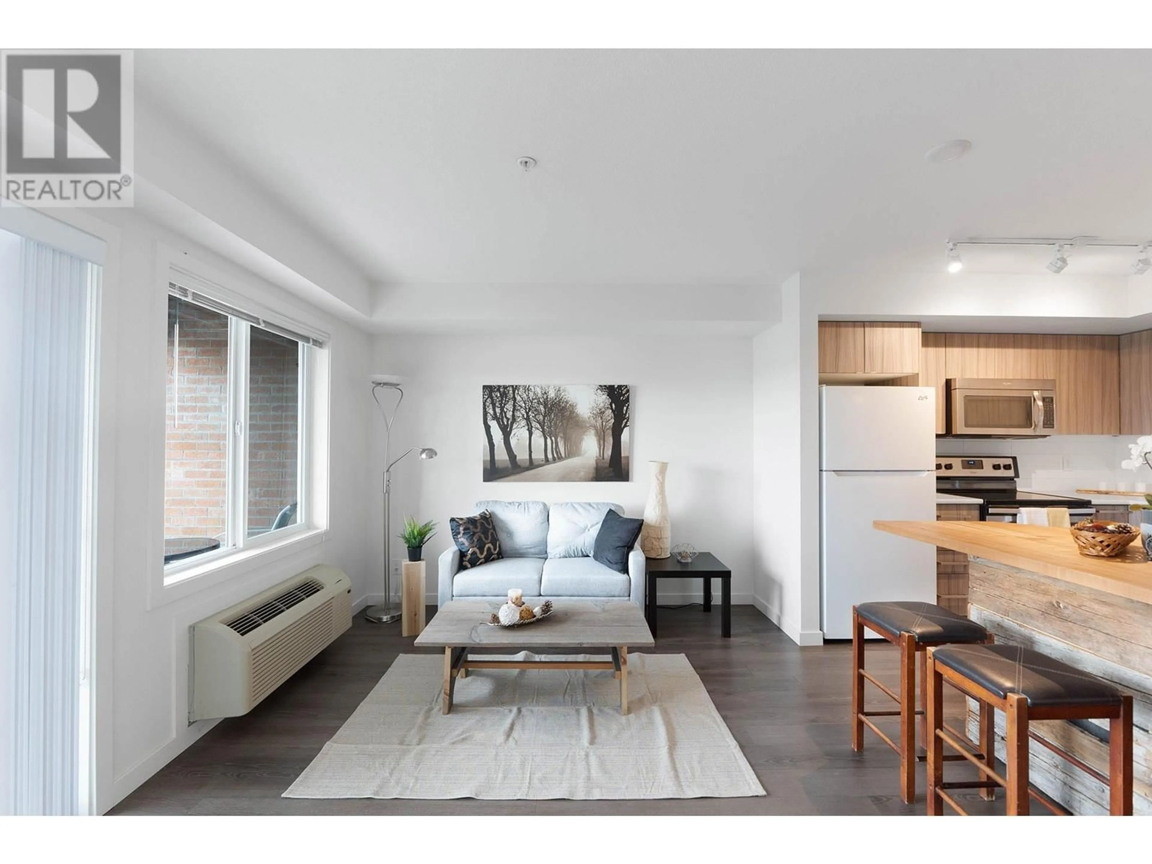 Living room with furniture, unknown for 103 - 881 ACADEMY WAY, Kelowna British Columbia V1V0A2