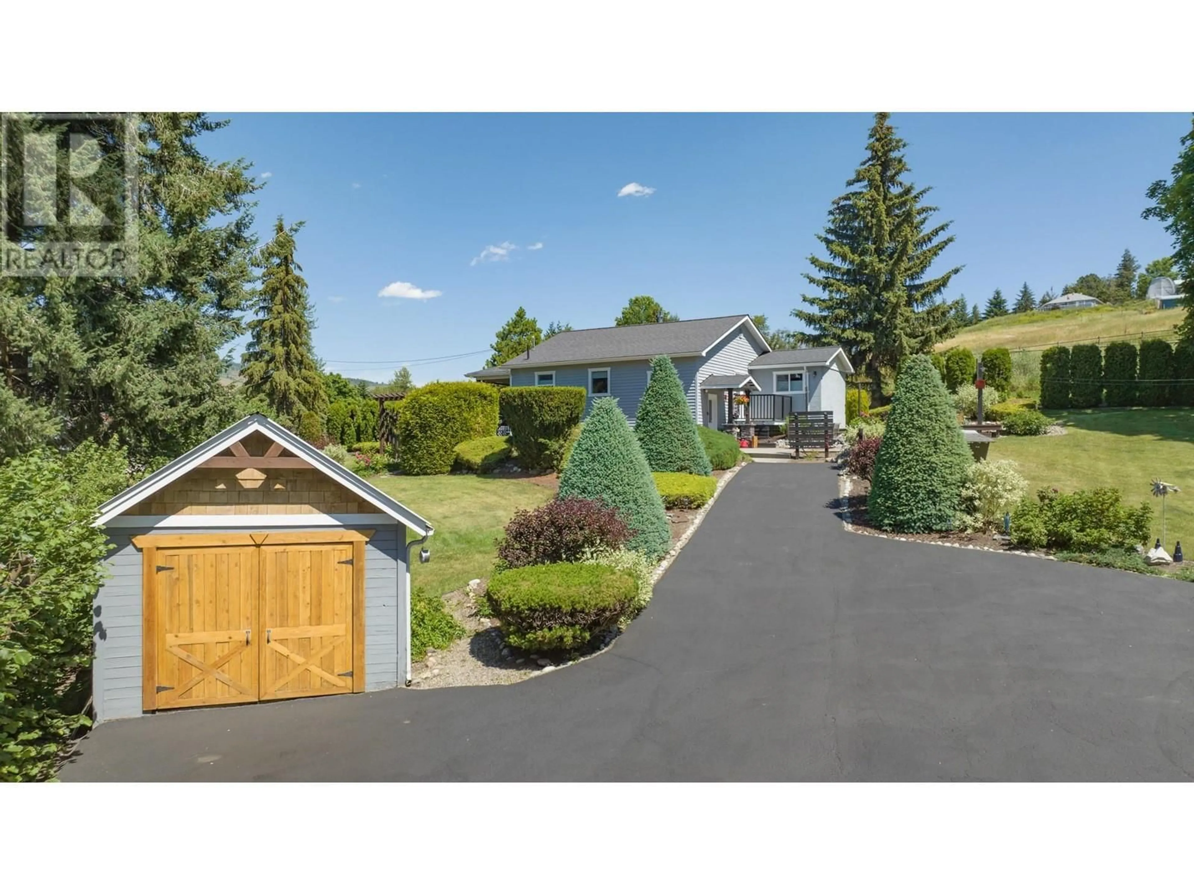 A pic from outside/outdoor area/front of a property/back of a property/a pic from drone, mountain view for 5648 LEARMOUTH ROAD, Coldstream British Columbia V1B3E6