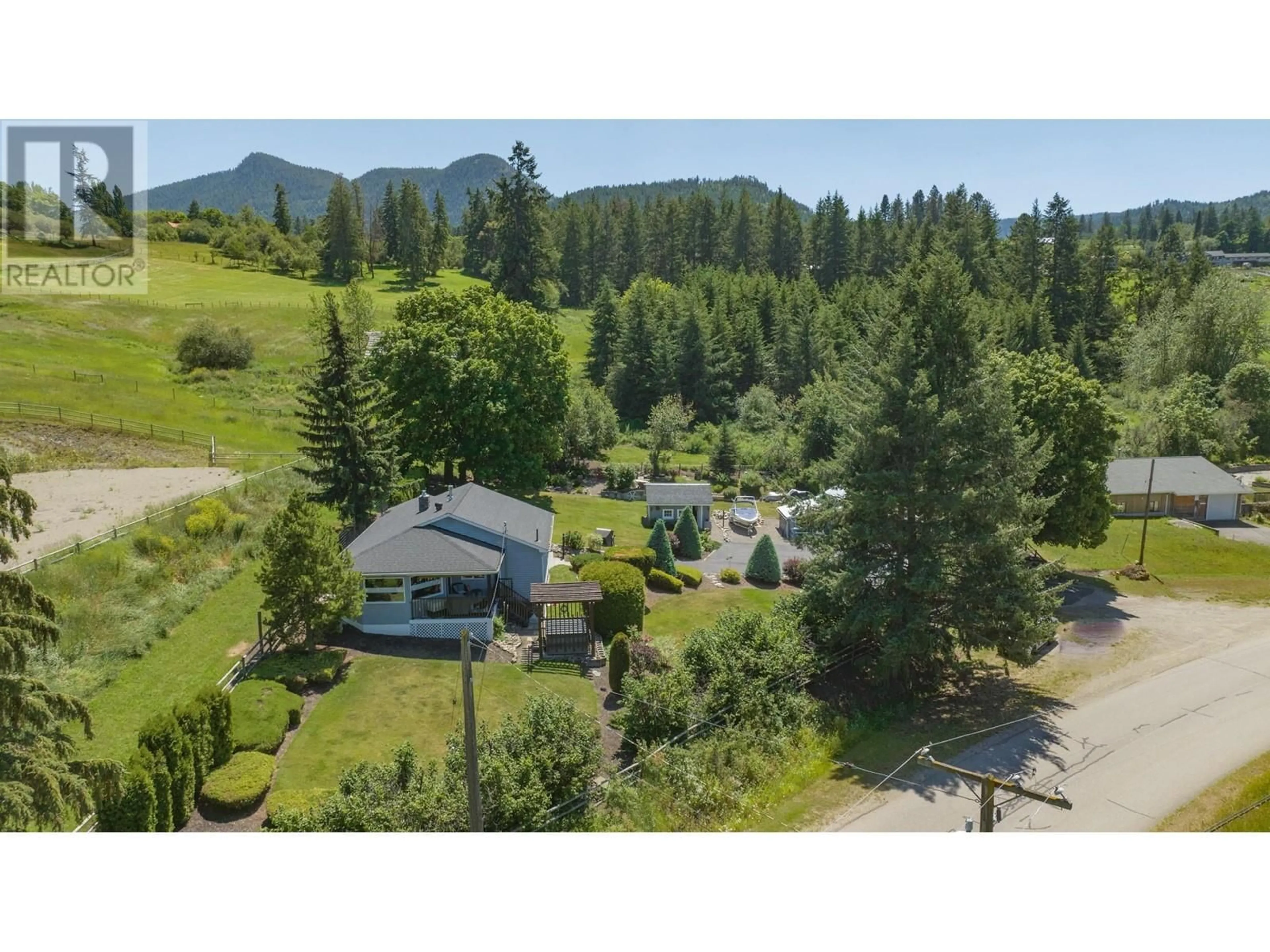 A pic from outside/outdoor area/front of a property/back of a property/a pic from drone, mountain view for 5648 LEARMOUTH ROAD, Coldstream British Columbia V1B3E6