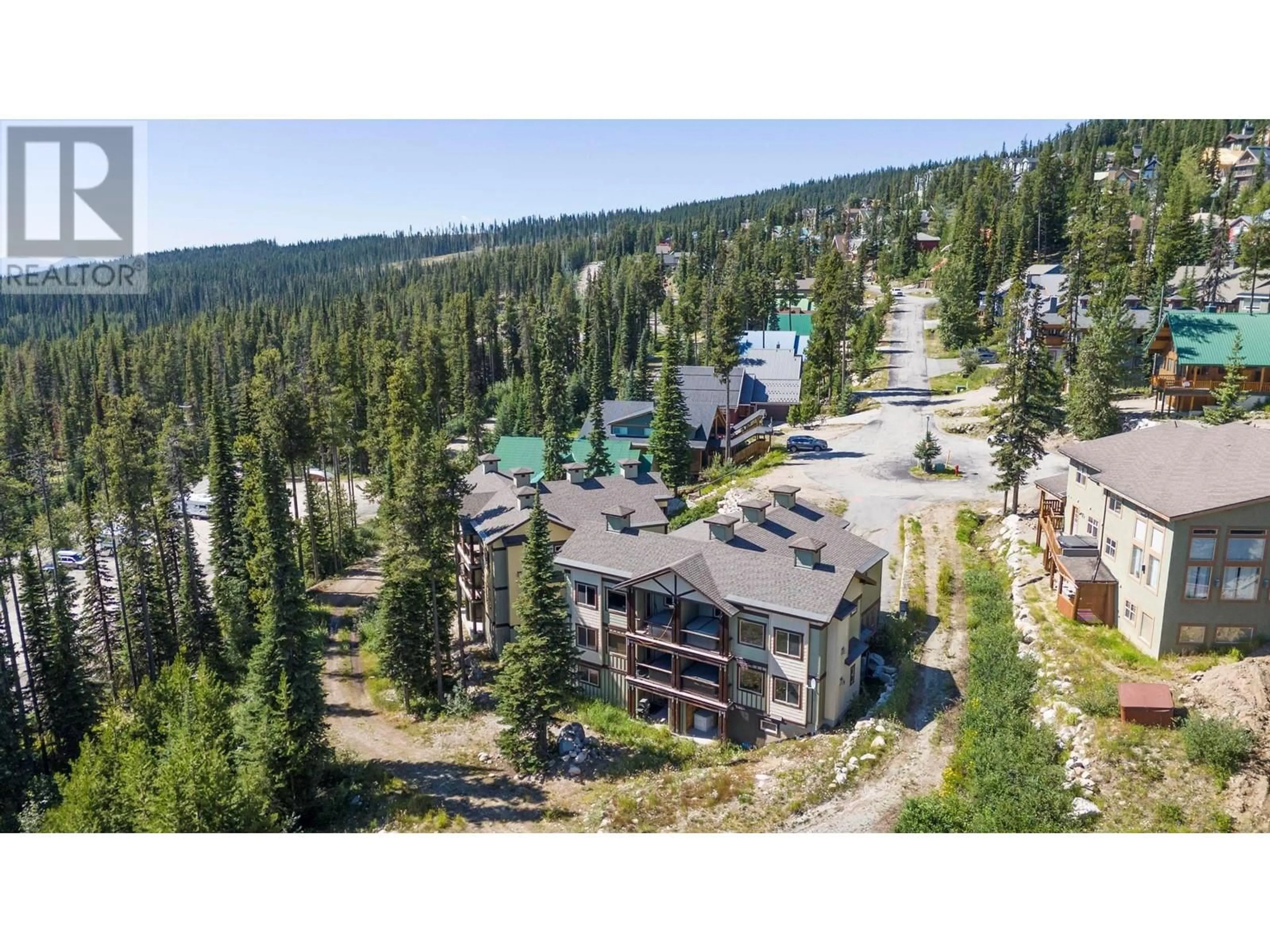 A pic from outside/outdoor area/front of a property/back of a property/a pic from drone, mountain view for 4 - 4939 SNOW PINES ROAD, Big White British Columbia V0E2G0