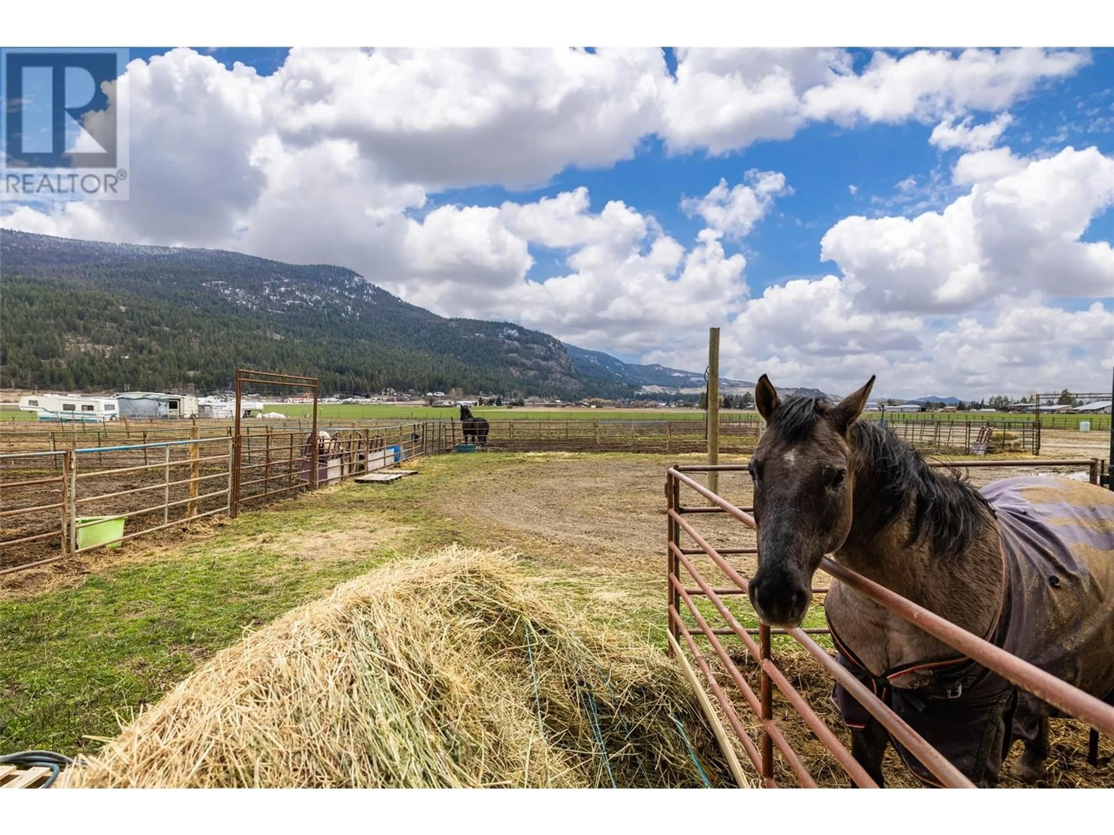 A pic from outside/outdoor area/front of a property/back of a property/a pic from drone, mountain view for 2411 HARDING ROAD, Spallumcheen British Columbia V4Y0V9