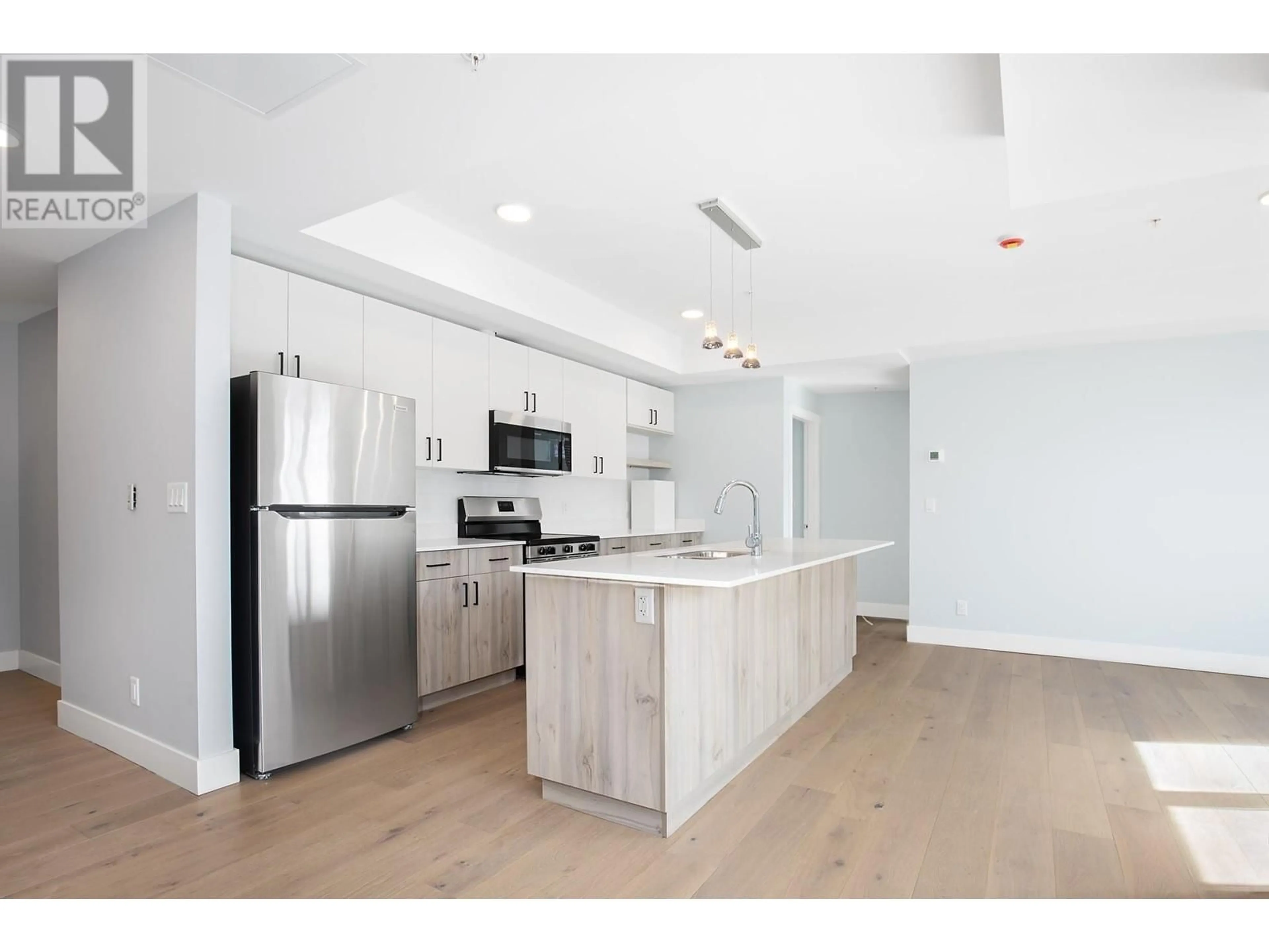 Open concept kitchen, wood/laminate floor for 204 - 215 ROYAL AVENUE, Kamloops British Columbia V2H1T7
