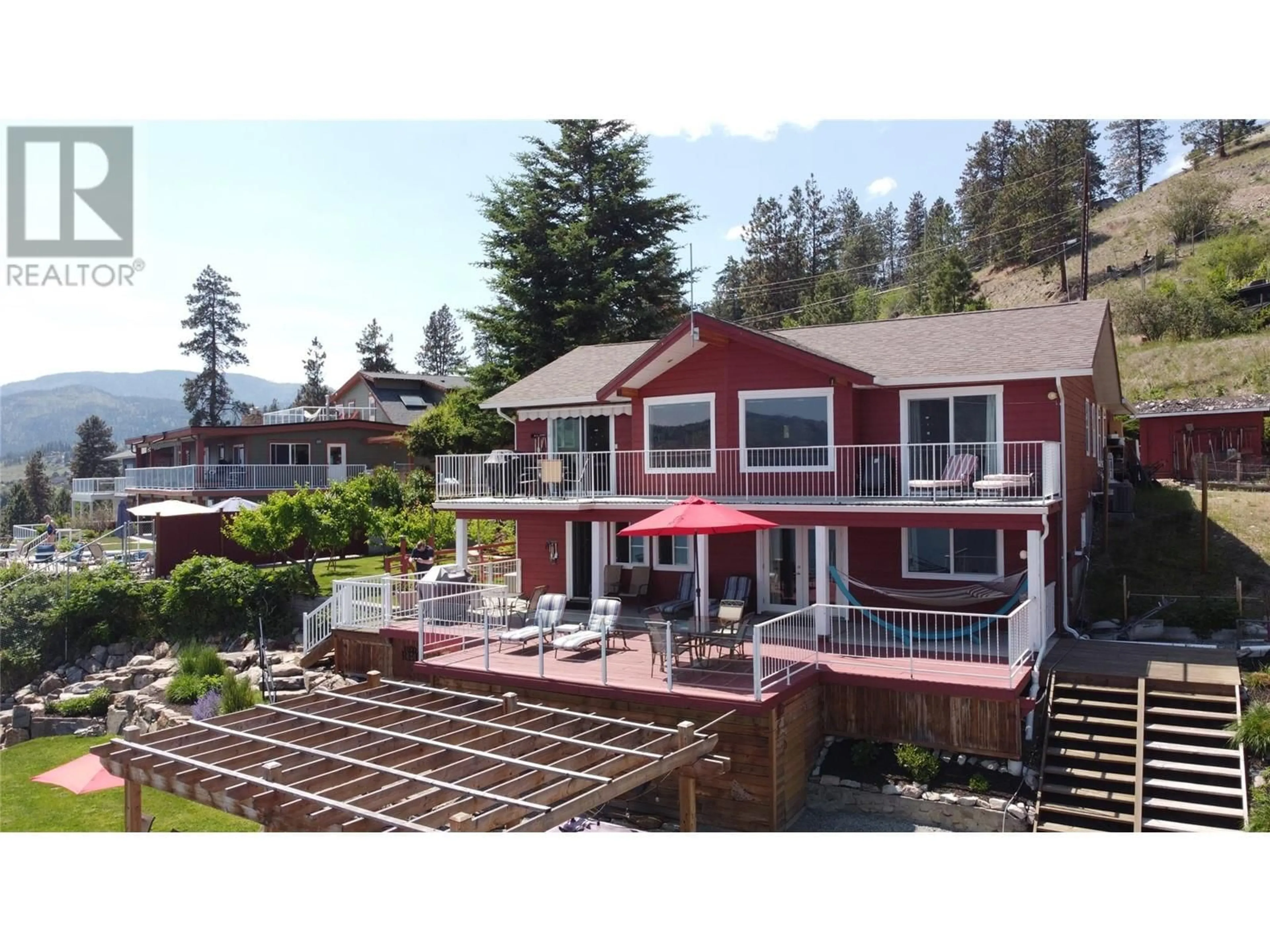 A pic from outside/outdoor area/front of a property/back of a property/a pic from drone, mountain view for 5803 ATKINSON CRESCENT, Peachland British Columbia V0H1X4