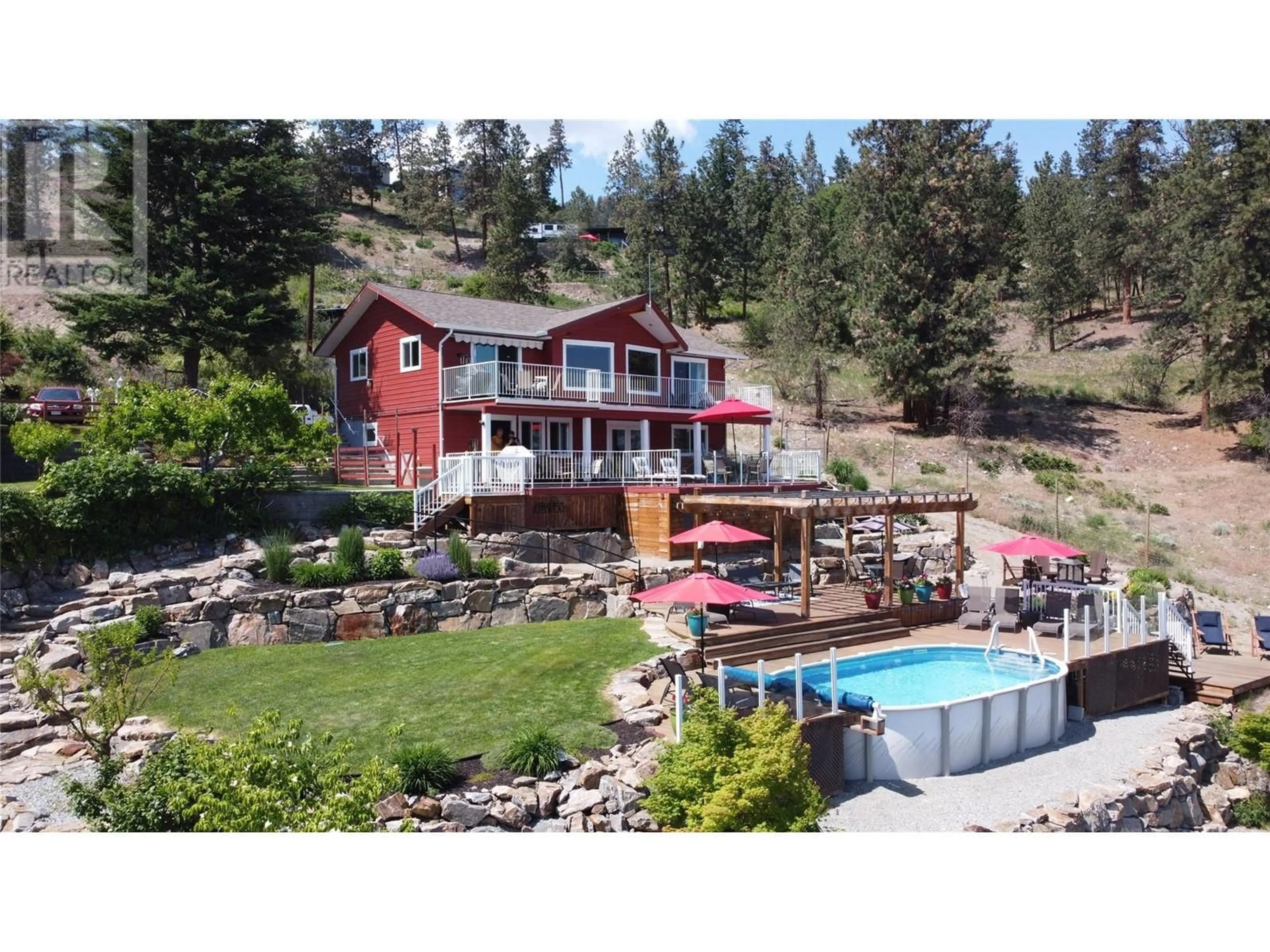 A pic from outside/outdoor area/front of a property/back of a property/a pic from drone, water/lake/river/ocean view for 5803 ATKINSON CRESCENT, Peachland British Columbia V0H1X4