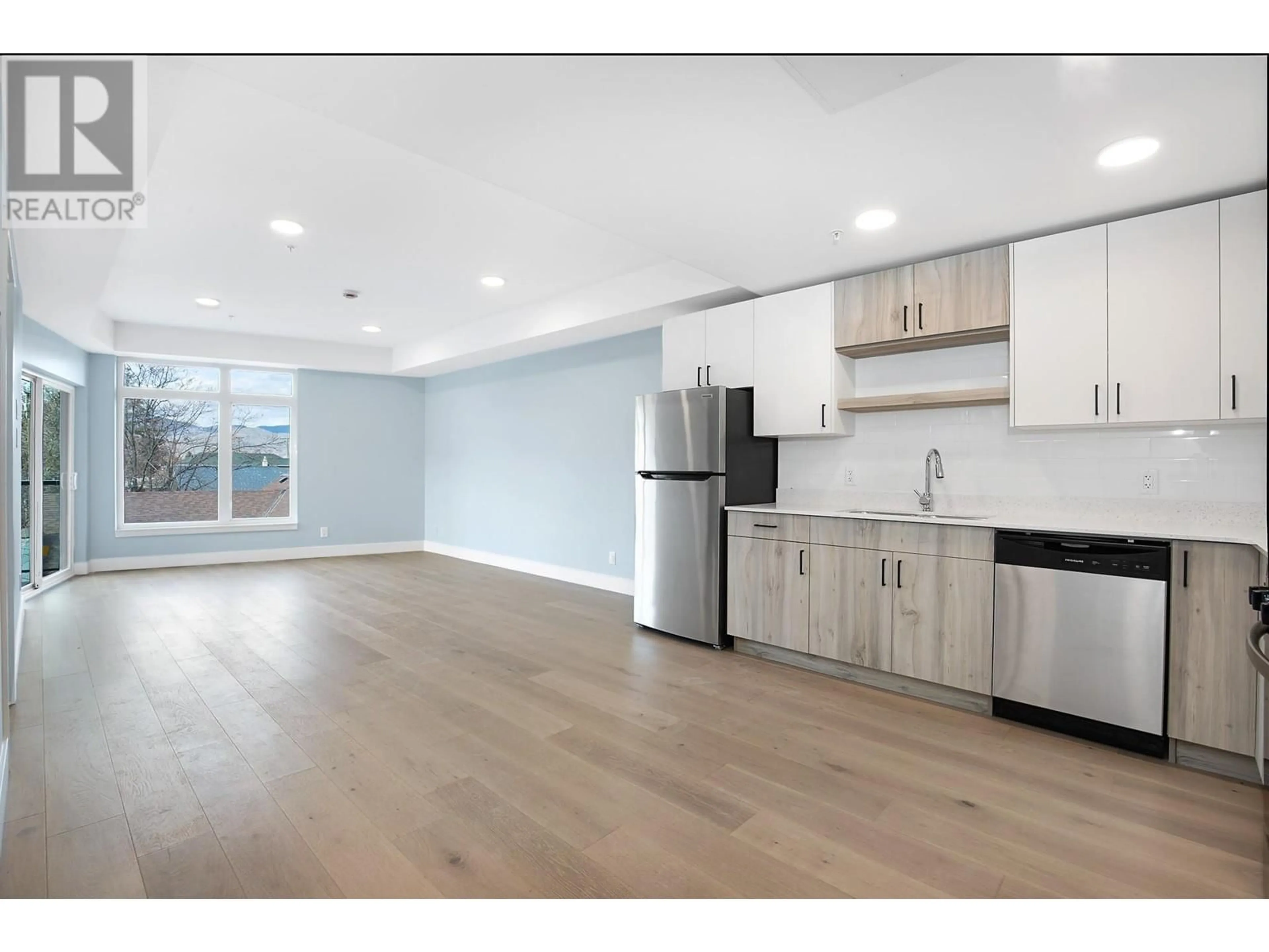 Open concept kitchen, wood/laminate floor for 207 - 215 ROYAL AVENUE, Kamloops British Columbia V2B8J7