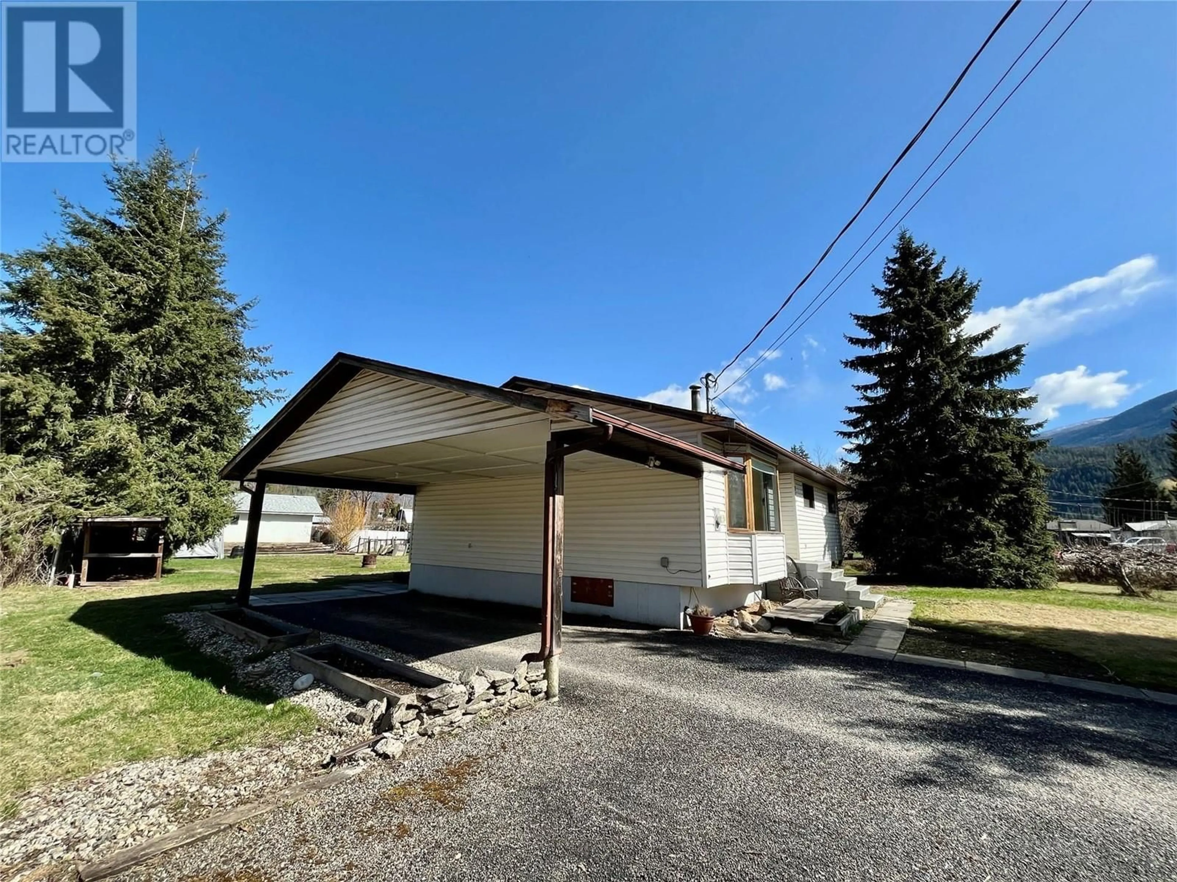 A pic from outside/outdoor area/front of a property/back of a property/a pic from drone, street for 914 RAUMA CRESCENT, Sicamous British Columbia V0E2V0