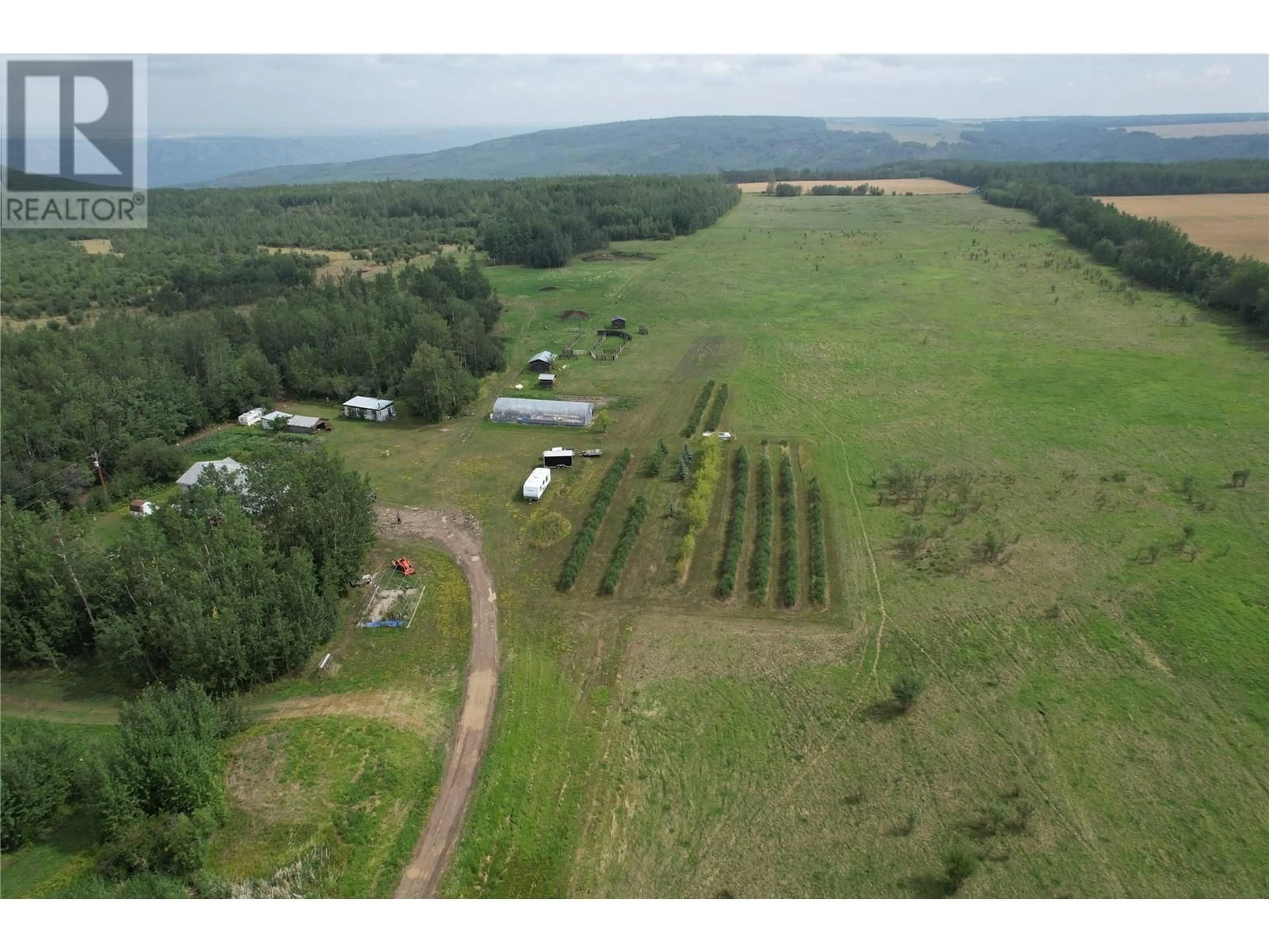 A pic from outside/outdoor area/front of a property/back of a property/a pic from drone, forest/trees view for 2770 241 ROAD, Dawson Creek British Columbia V0C2K0