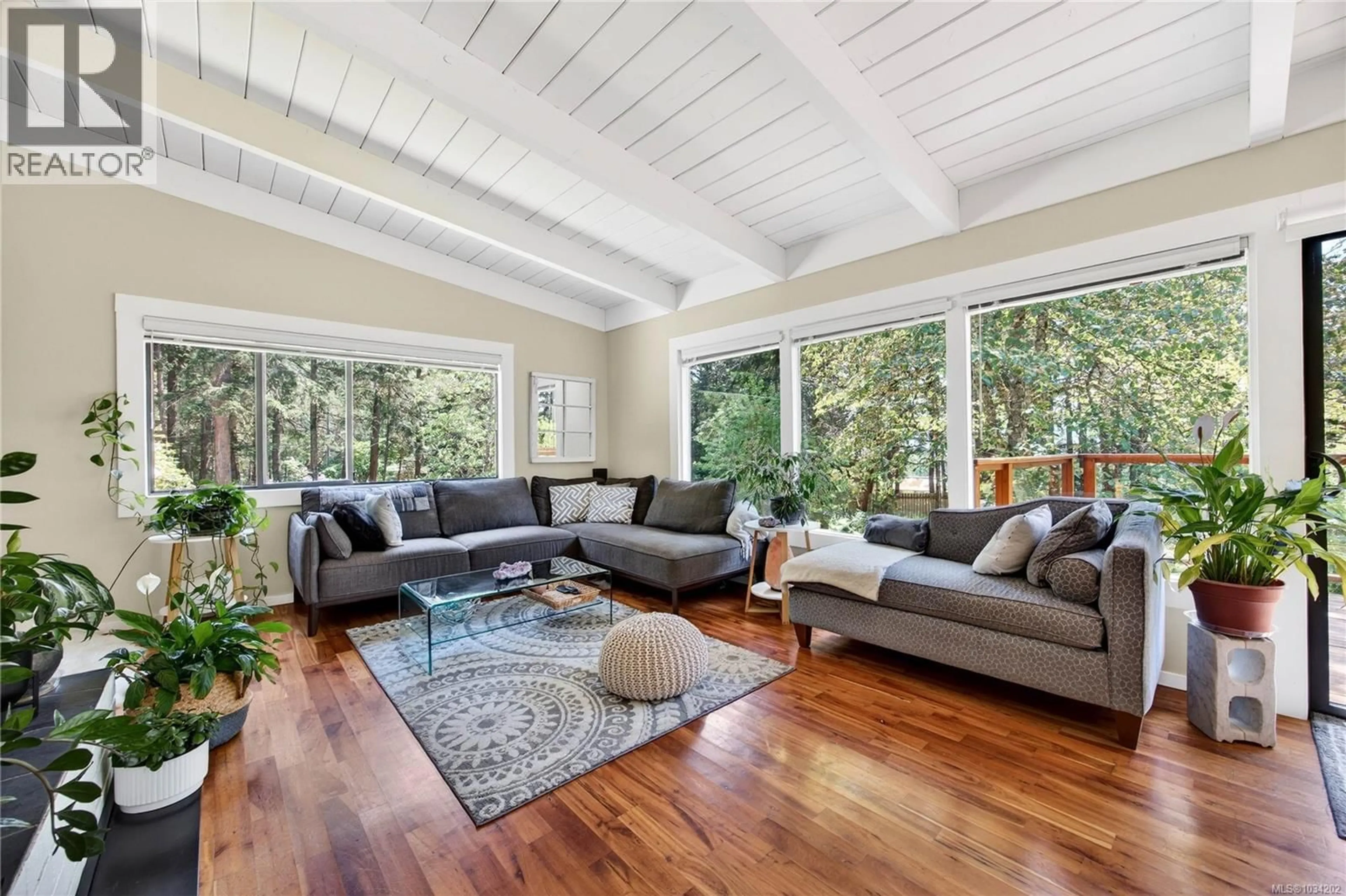 Living room with furniture, wood/laminate floor for 296 WOODLAND DRIVE, Salt Spring British Columbia V8K1J6