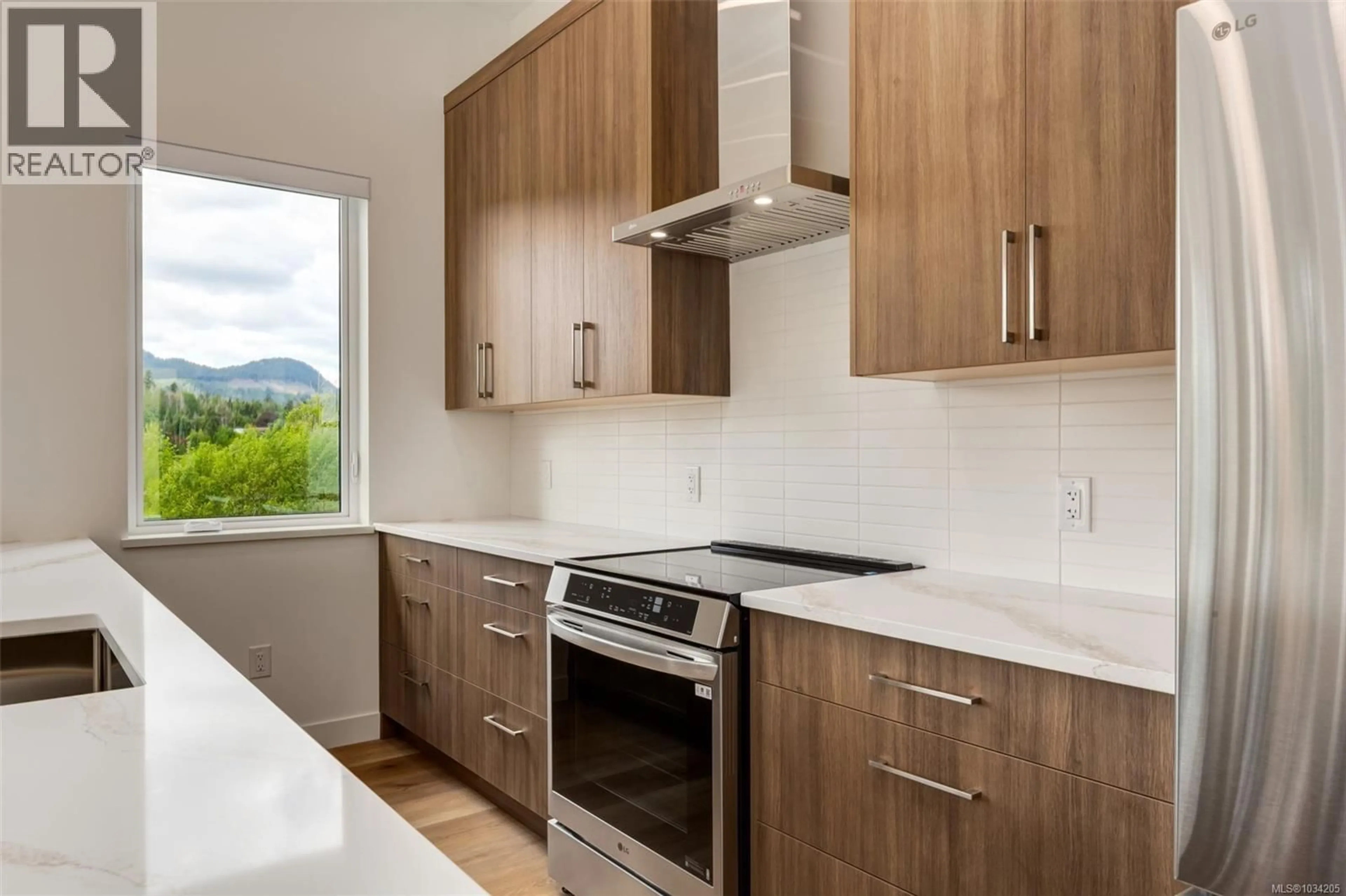 Standard kitchen, wood/laminate floor for 205 - 7181 LANTZVILLE ROAD, Lantzville British Columbia V0R2H0