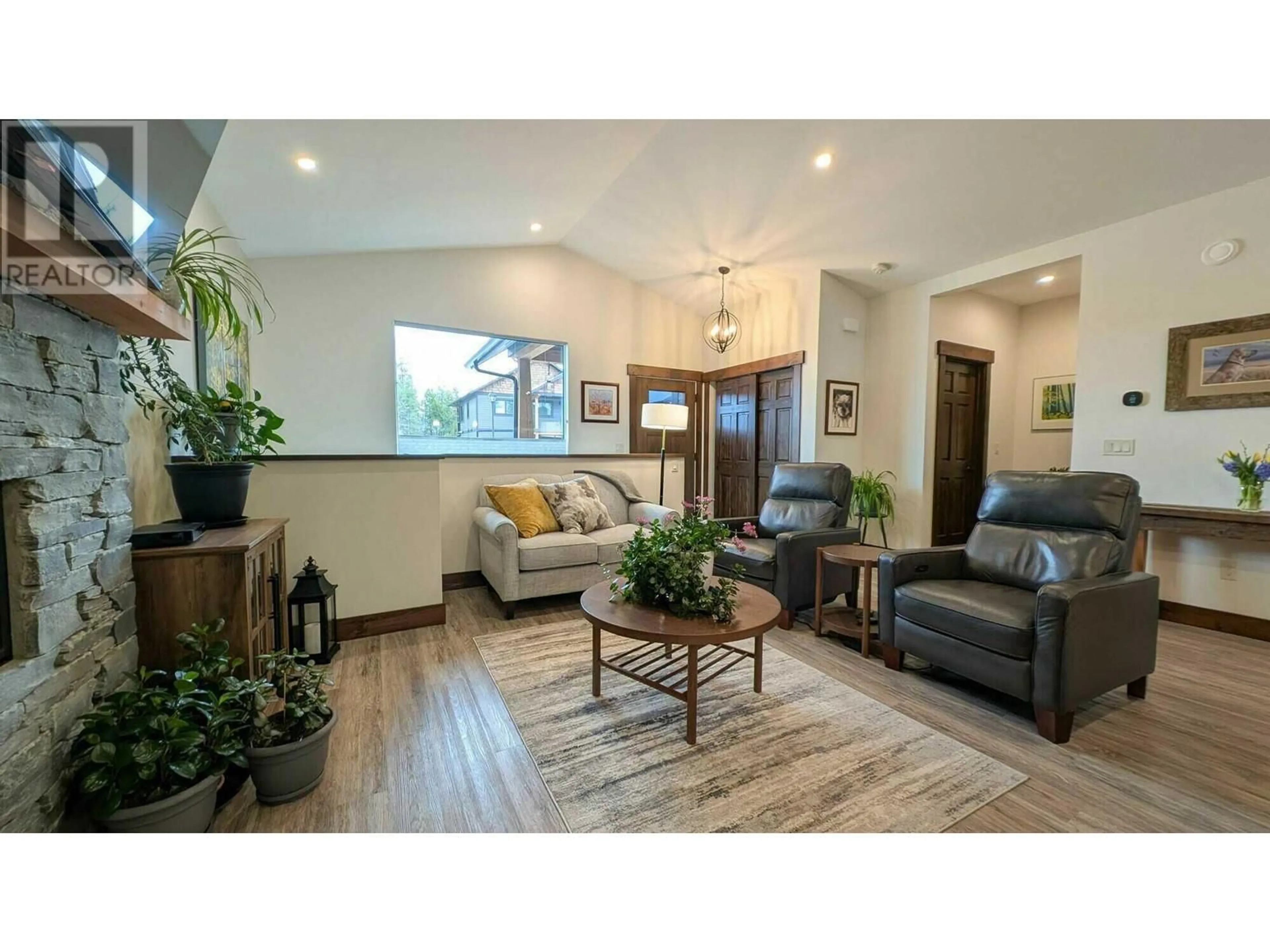Living room with furniture, wood/laminate floor for 438 FOREST CROWNE RISE, Kimberley British Columbia V1A0A5