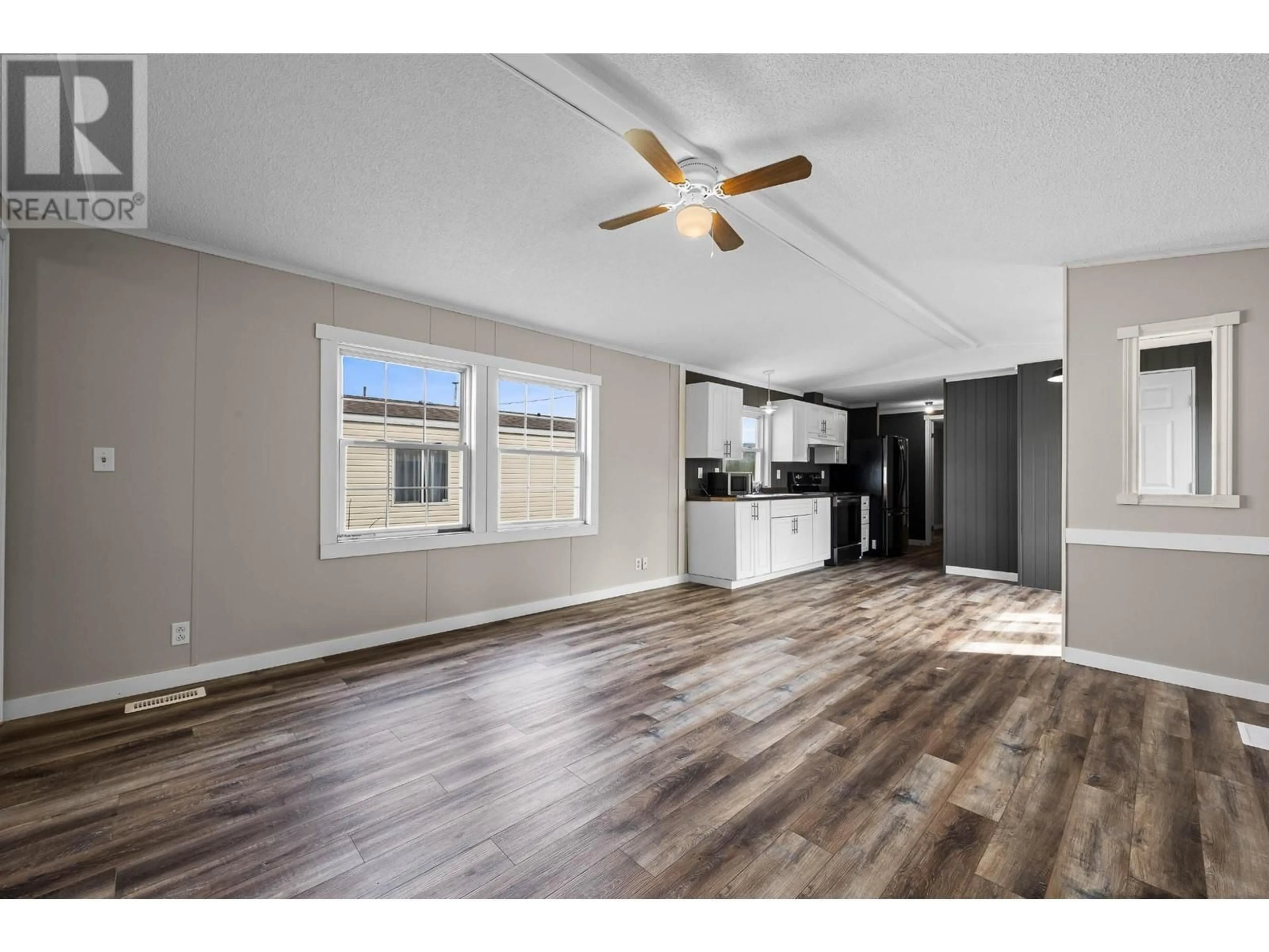 Open concept kitchen, wood/laminate floor for 8 - 1401 NICOLA AVENUE, Merritt British Columbia V1k0B1