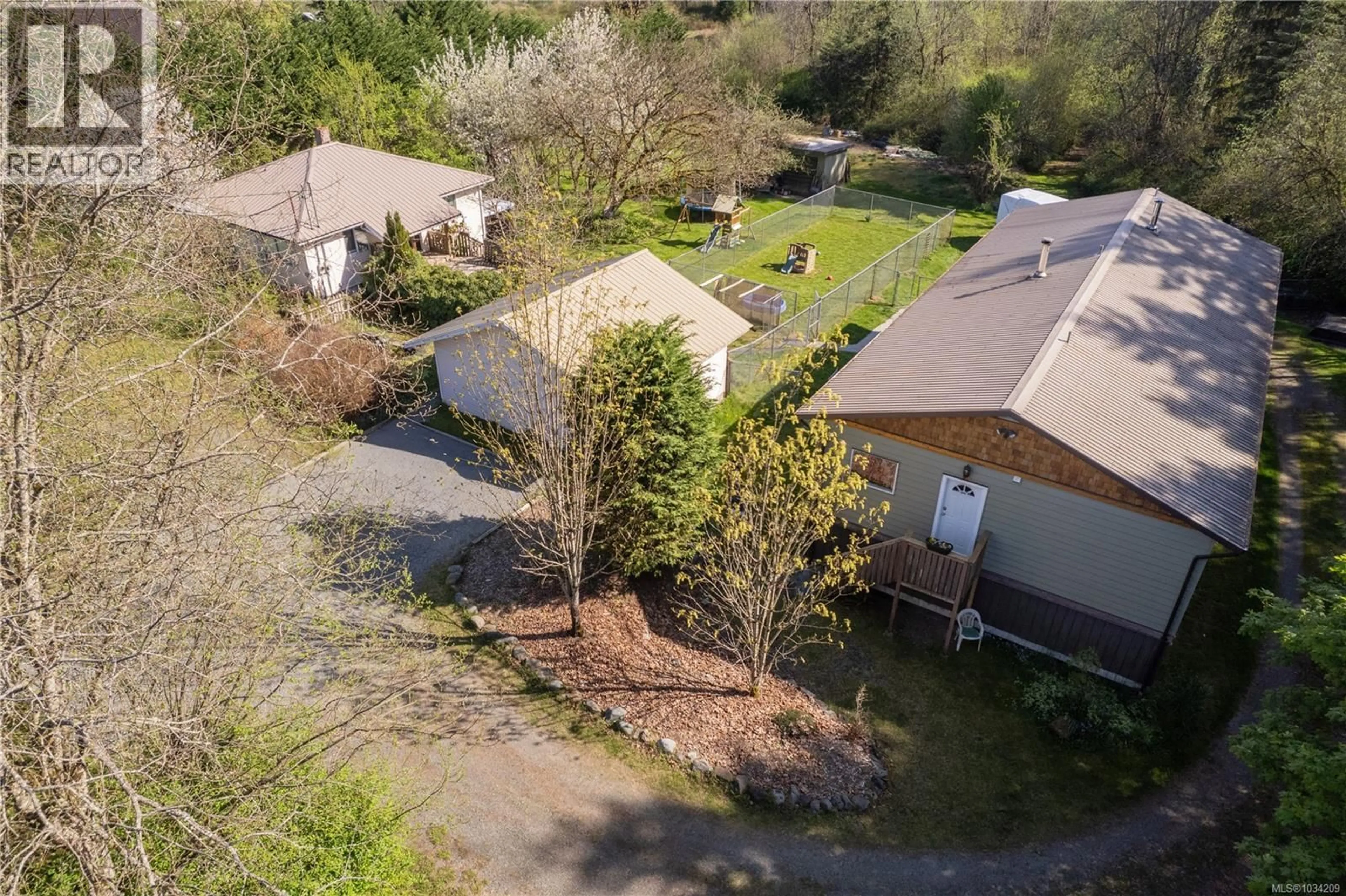 A pic from outside/outdoor area/front of a property/back of a property/a pic from drone, street for 3468 COWICHAN LAKE ROAD, Duncan British Columbia V9L6K5