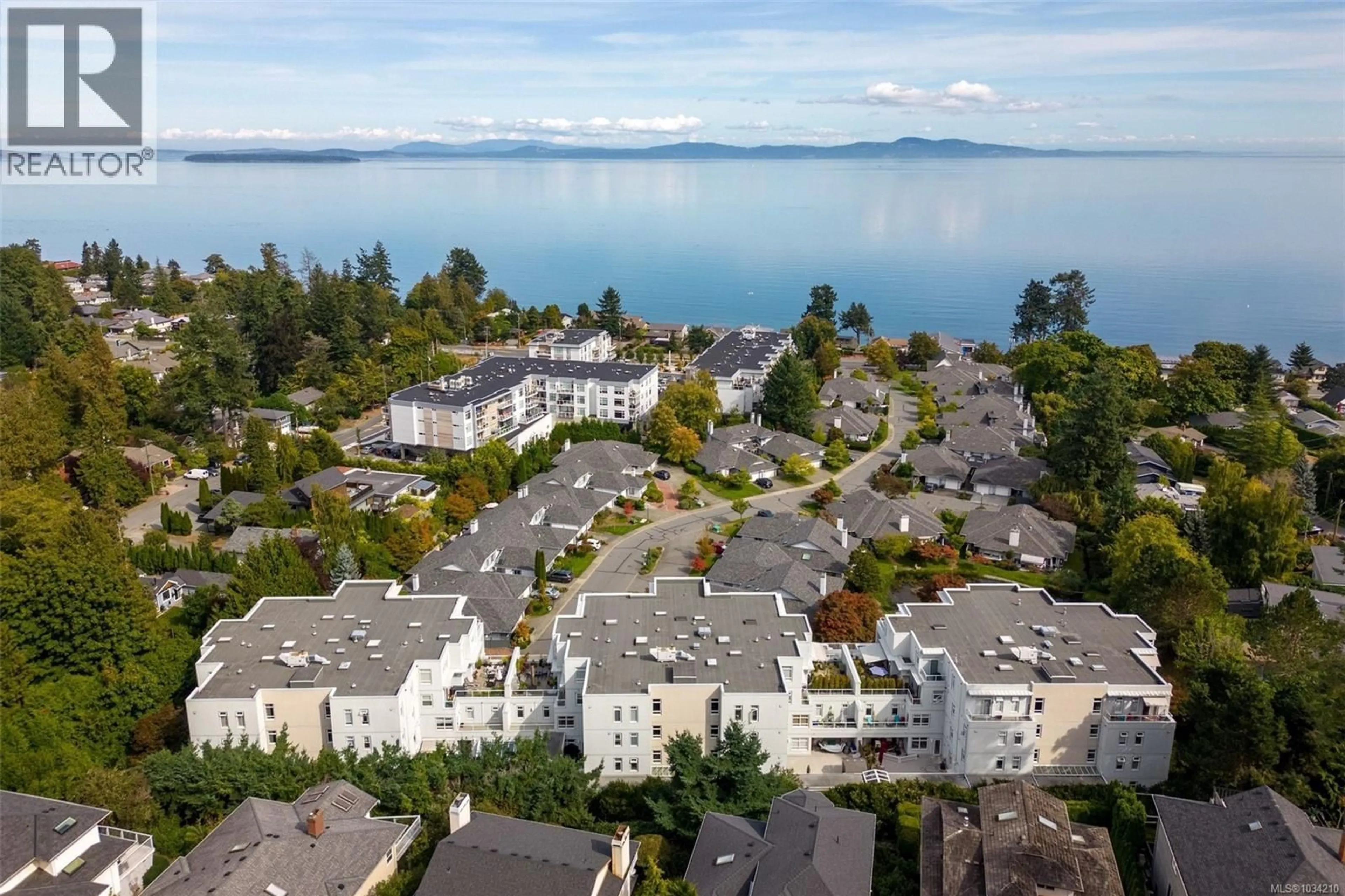A pic from outside/outdoor area/front of a property/back of a property/a pic from drone, water/lake/river/ocean view for 209 - 5110 CORDOVA BAY ROAD, Saanich British Columbia V8Y2K5