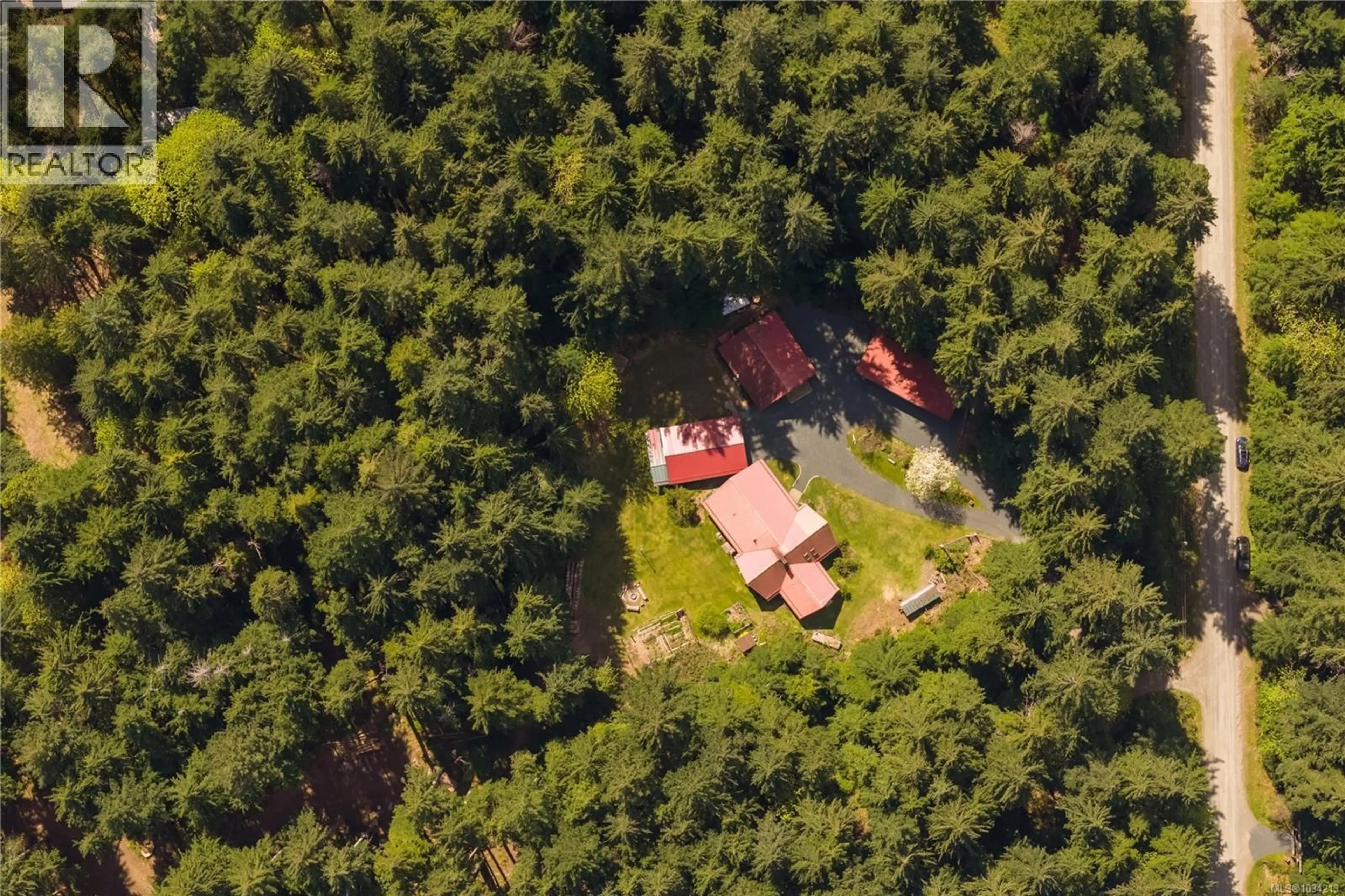 A pic from outside/outdoor area/front of a property/back of a property/a pic from drone, forest/trees view for 9025 GILGAN STREET, Honeymoon Bay British Columbia V0R3E1