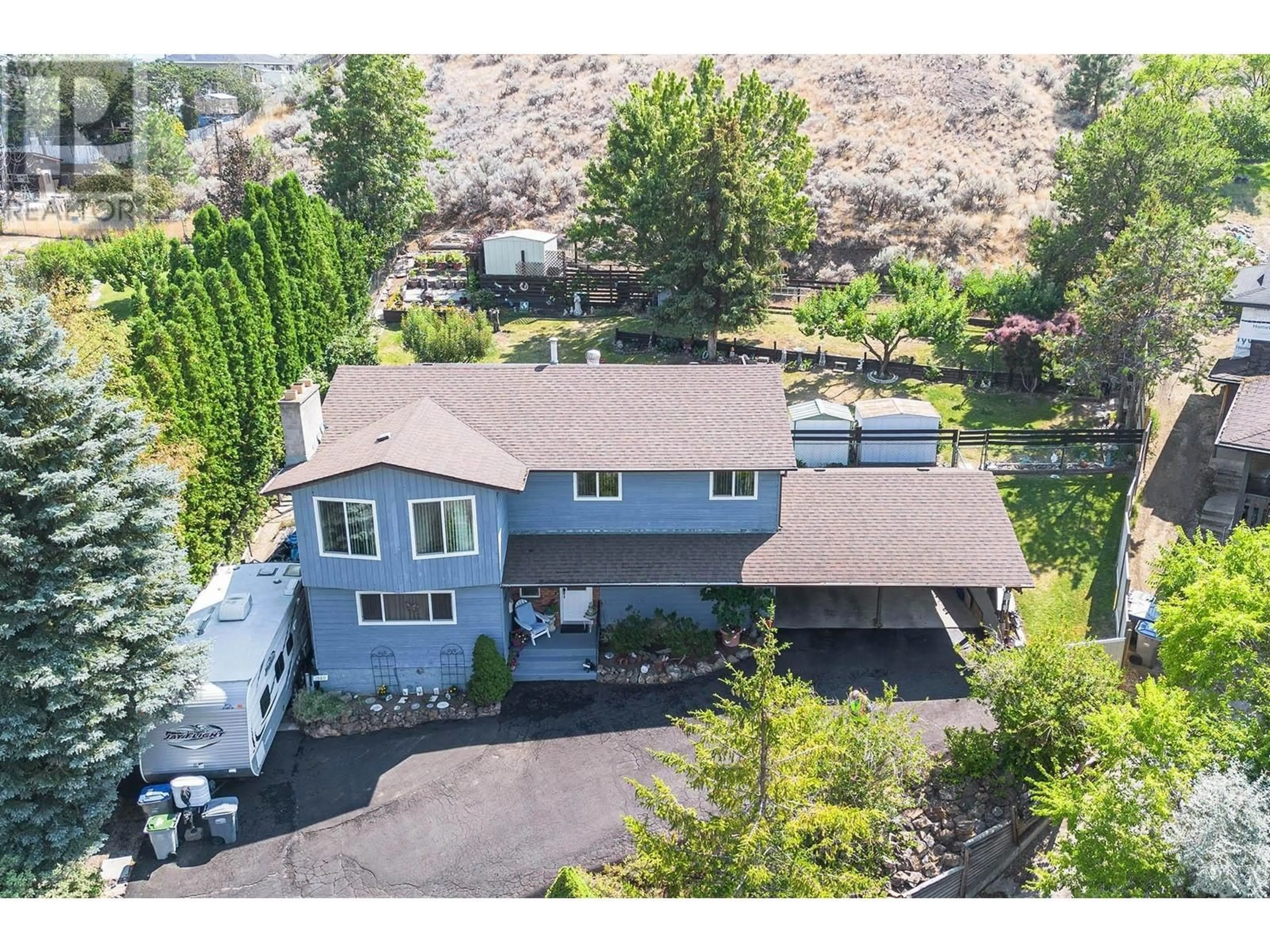 A pic from outside/outdoor area/front of a property/back of a property/a pic from drone, mountain view for 1580 NAPIER PLACE, Kamloops British Columbia V2B7R9