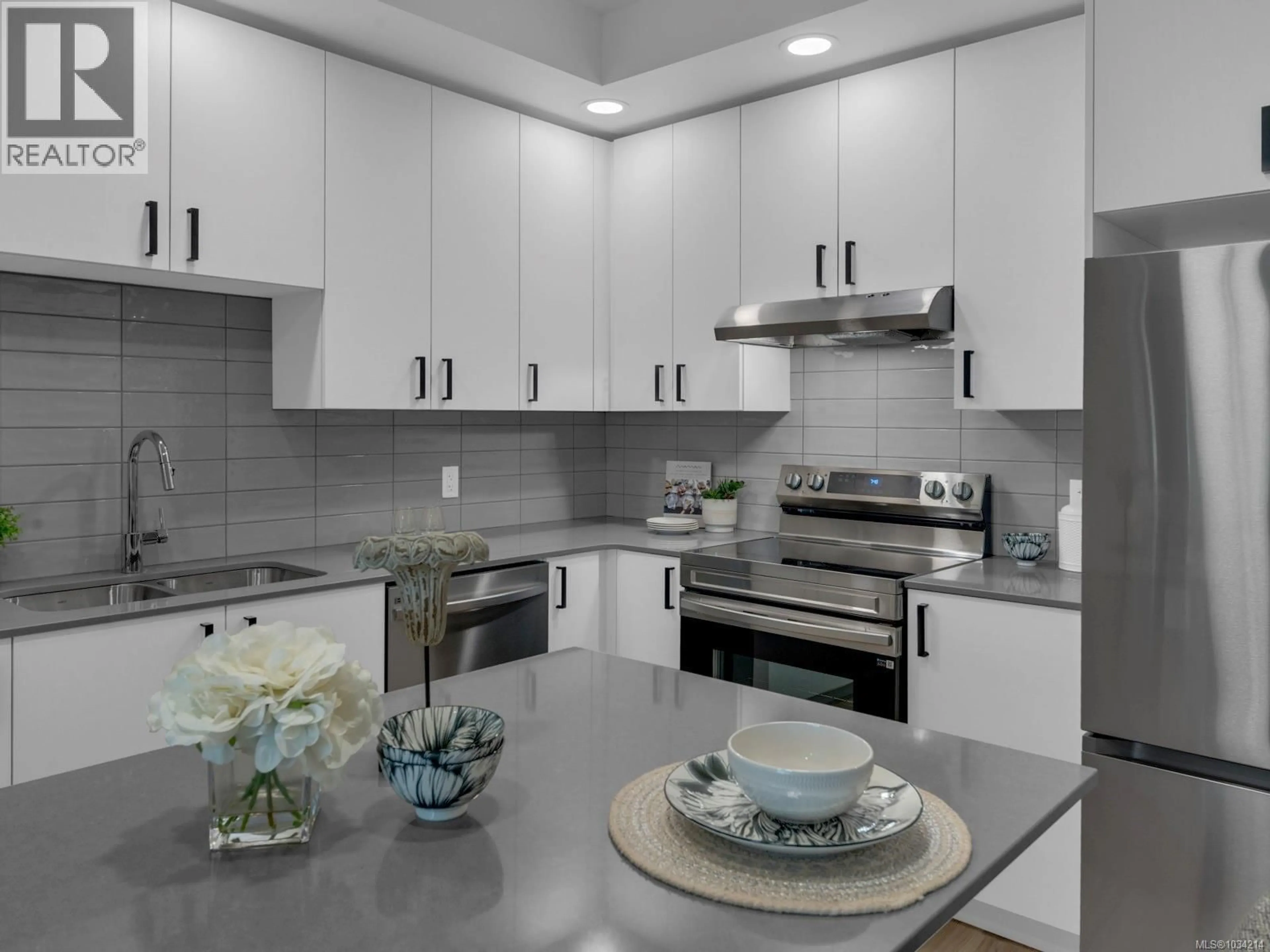 Open concept kitchen, ceramic/tile floor for 617 - 2390 CITY GATE BOULEVARD, Langford British Columbia V9B7E8