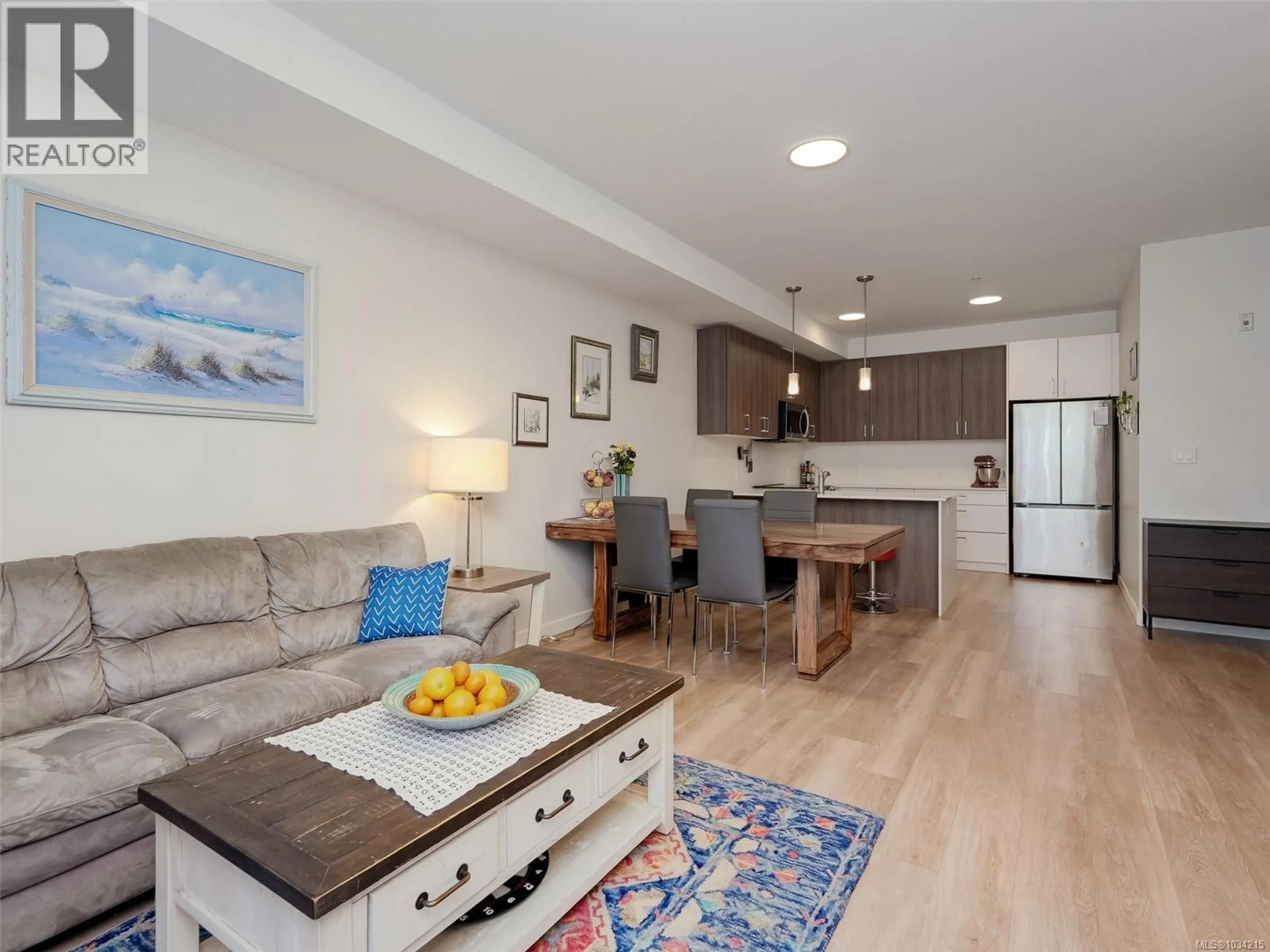 Open concept kitchen, wood/laminate floor for 301 - 815 ORONO AVENUE, Langford British Columbia V9B2T9