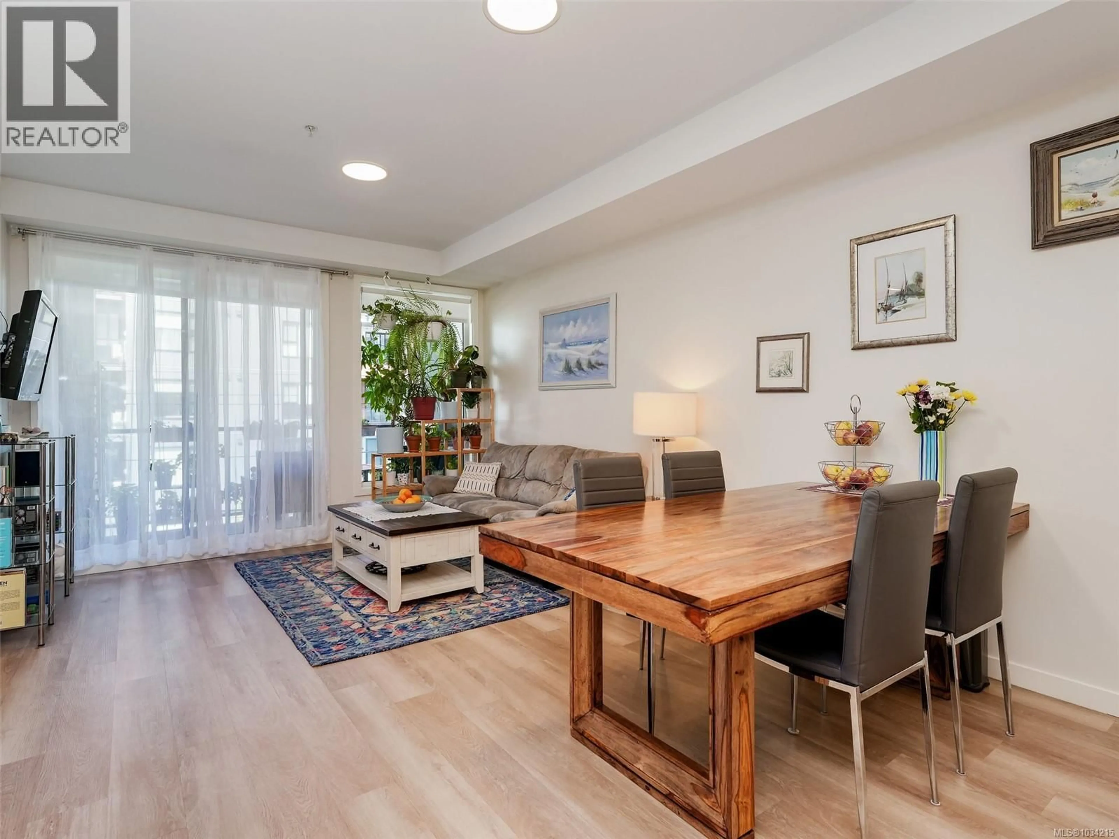Living room with furniture, wood/laminate floor for 301 - 815 ORONO AVENUE, Langford British Columbia V9B2T9