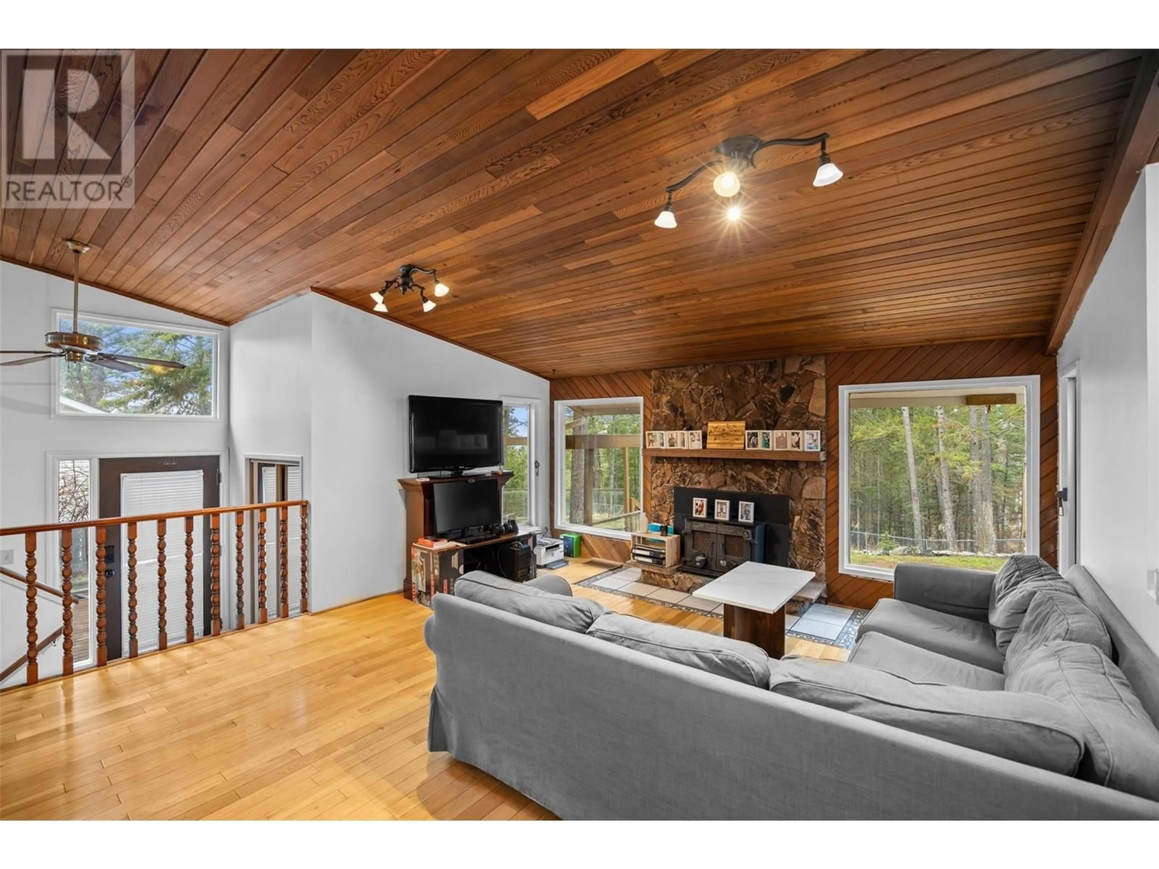 Living room with furniture, wood/laminate floor for 37 BRECCIA DRIVE, Logan Lake British Columbia V0K1W0