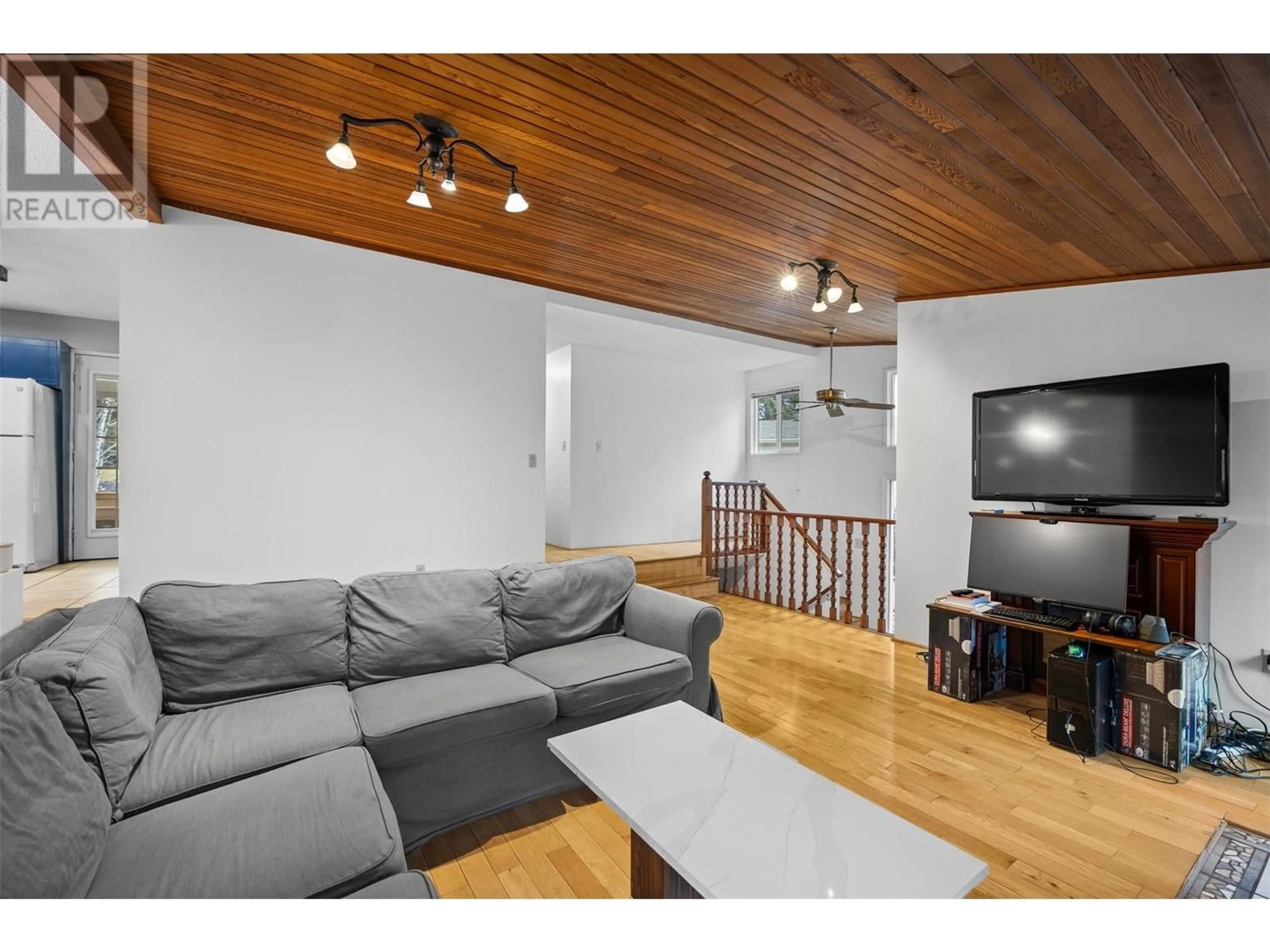 Living room with furniture, wood/laminate floor for 37 BRECCIA DRIVE, Logan Lake British Columbia V0K1W0