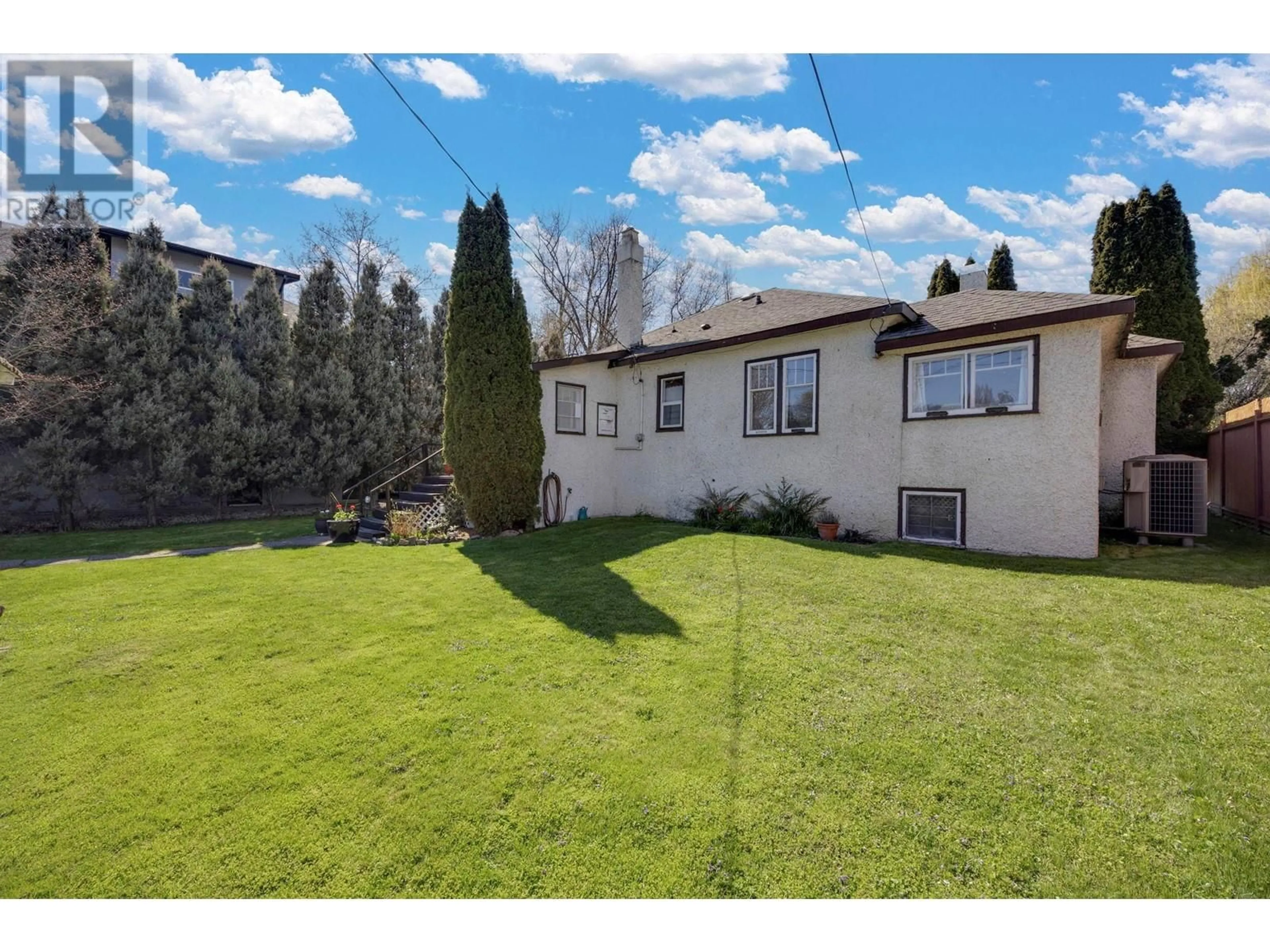 A pic from outside/outdoor area/front of a property/back of a property/a pic from drone, unknown for 1830 RIVERSIDE AVENUE, Kelowna British Columbia V1Y1A7
