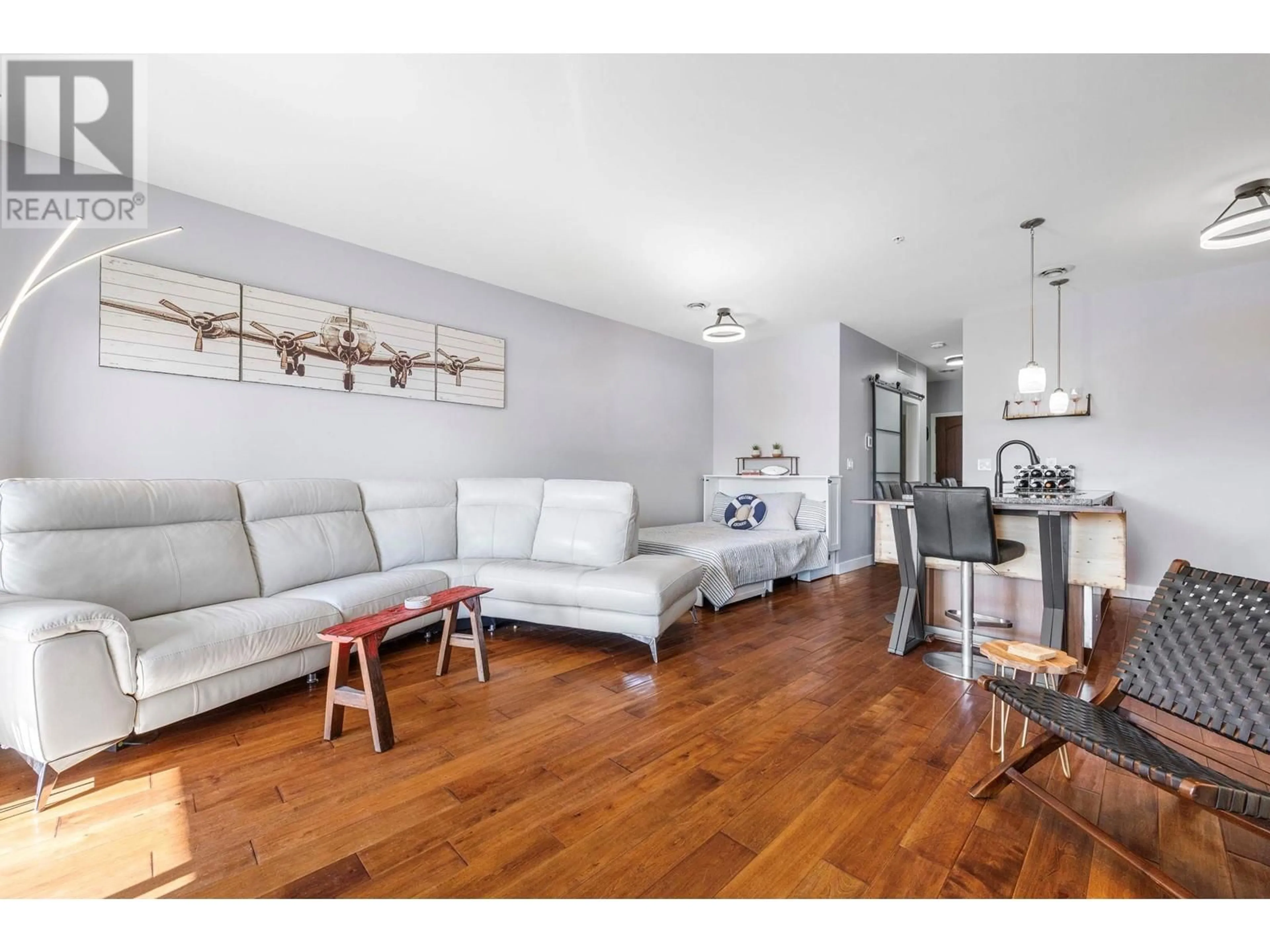 Living room with furniture, wood/laminate floor for 8205 - 4028 PRITCHARD DRIVE, West Kelowna British Columbia V4T2N6