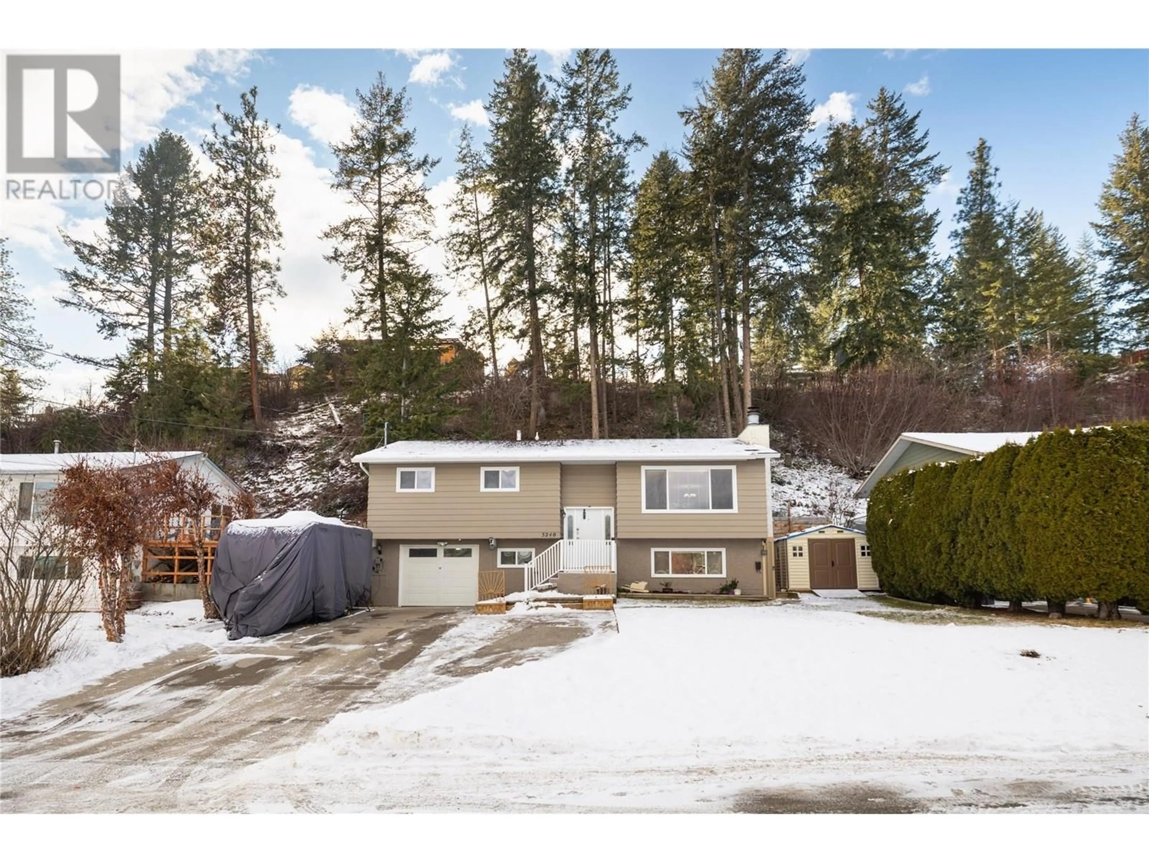 A pic from outside/outdoor area/front of a property/back of a property/a pic from drone, street for 3240 MCGINNIS ROAD, West Kelowna British Columbia V4T1A8