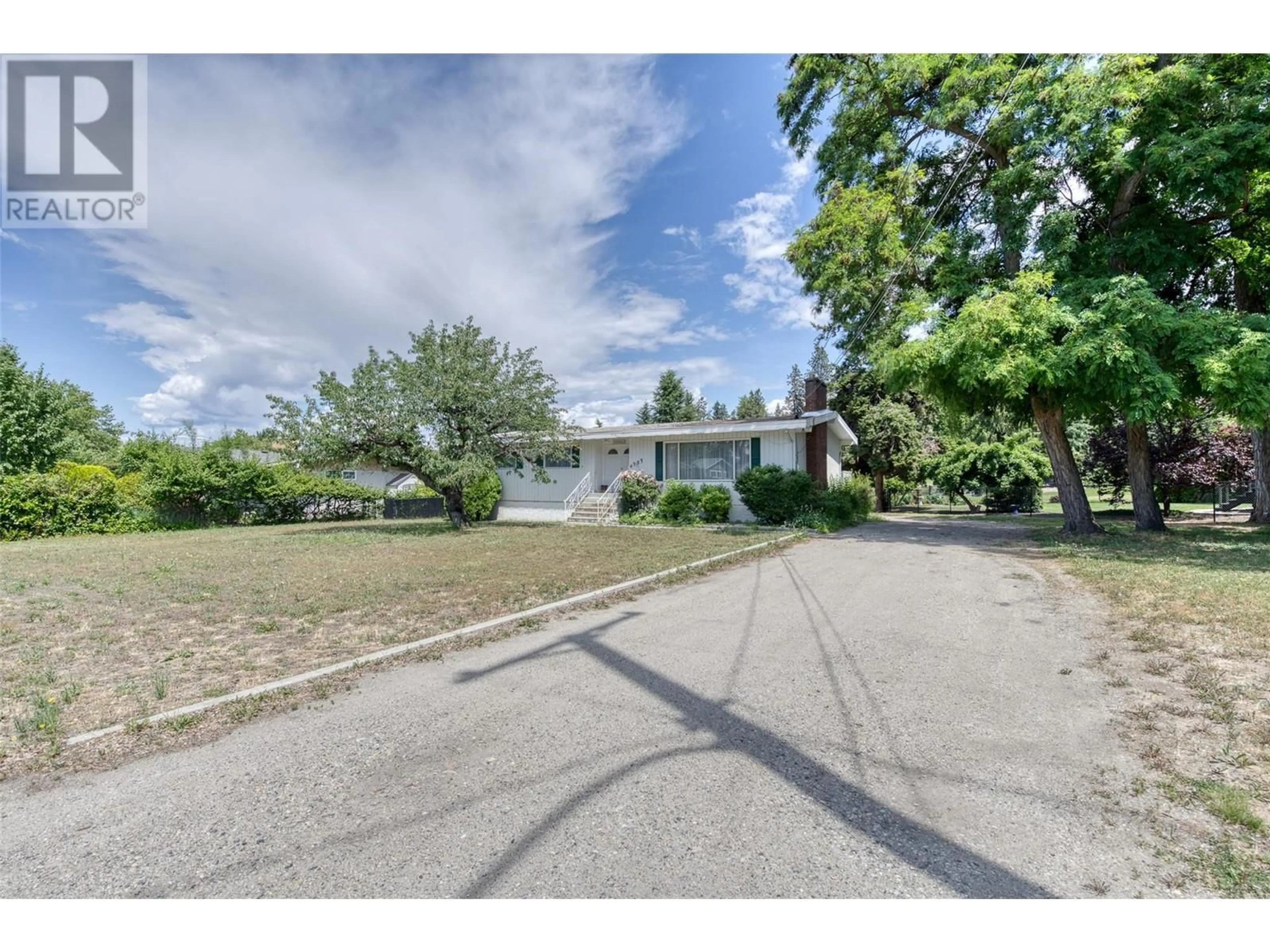 A pic from outside/outdoor area/front of a property/back of a property/a pic from drone, street for 4383 GORDON DRIVE, Kelowna British Columbia V1W1S7