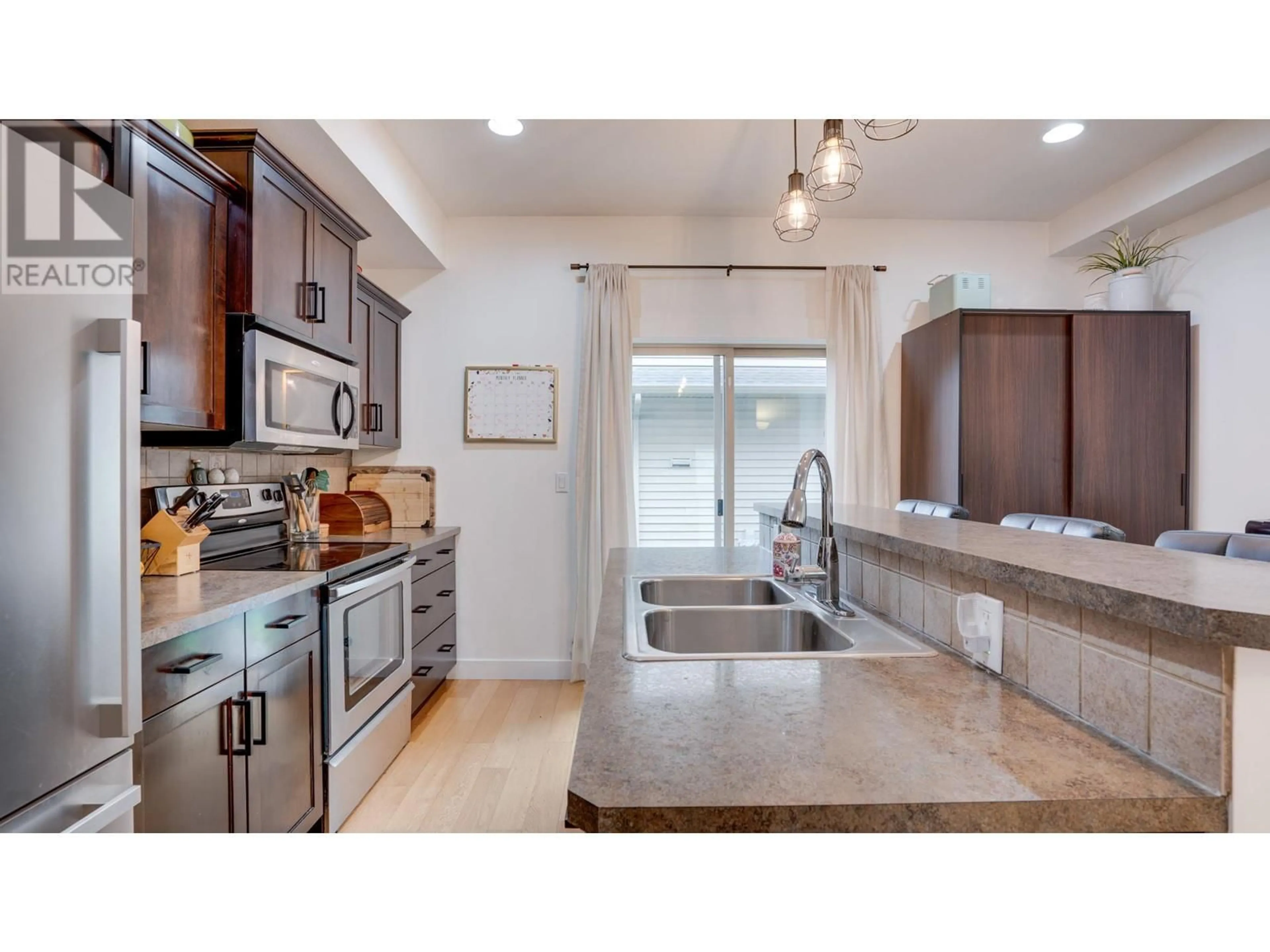 Open concept kitchen, ceramic/tile floor for 1003 - 4900 HERITAGE DRIVE, Vernon British Columbia V1T9X1