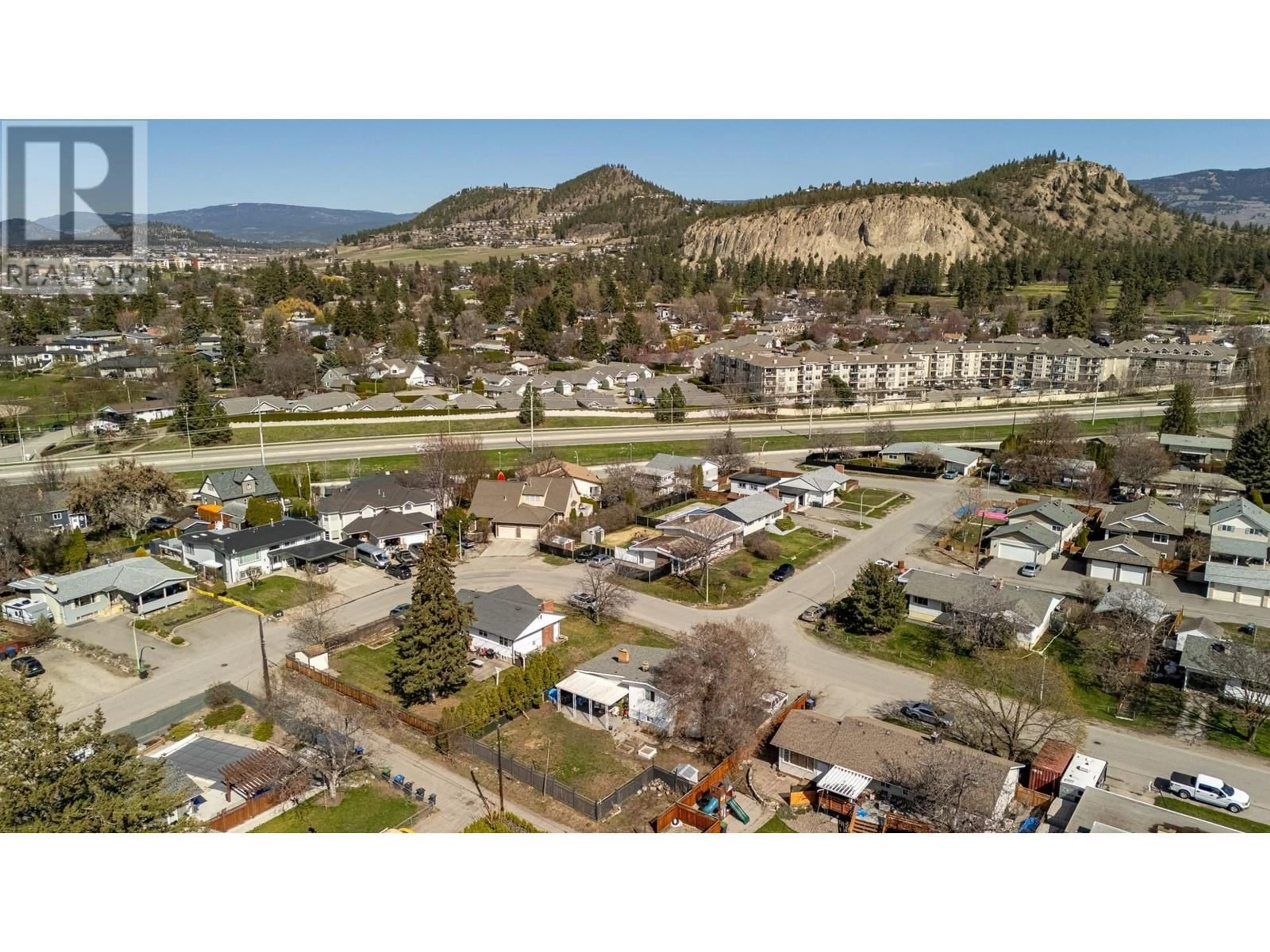 A pic from outside/outdoor area/front of a property/back of a property/a pic from drone, mountain view for 1388 CHERRY CRESCENT WEST, Kelowna British Columbia V1Y3X8