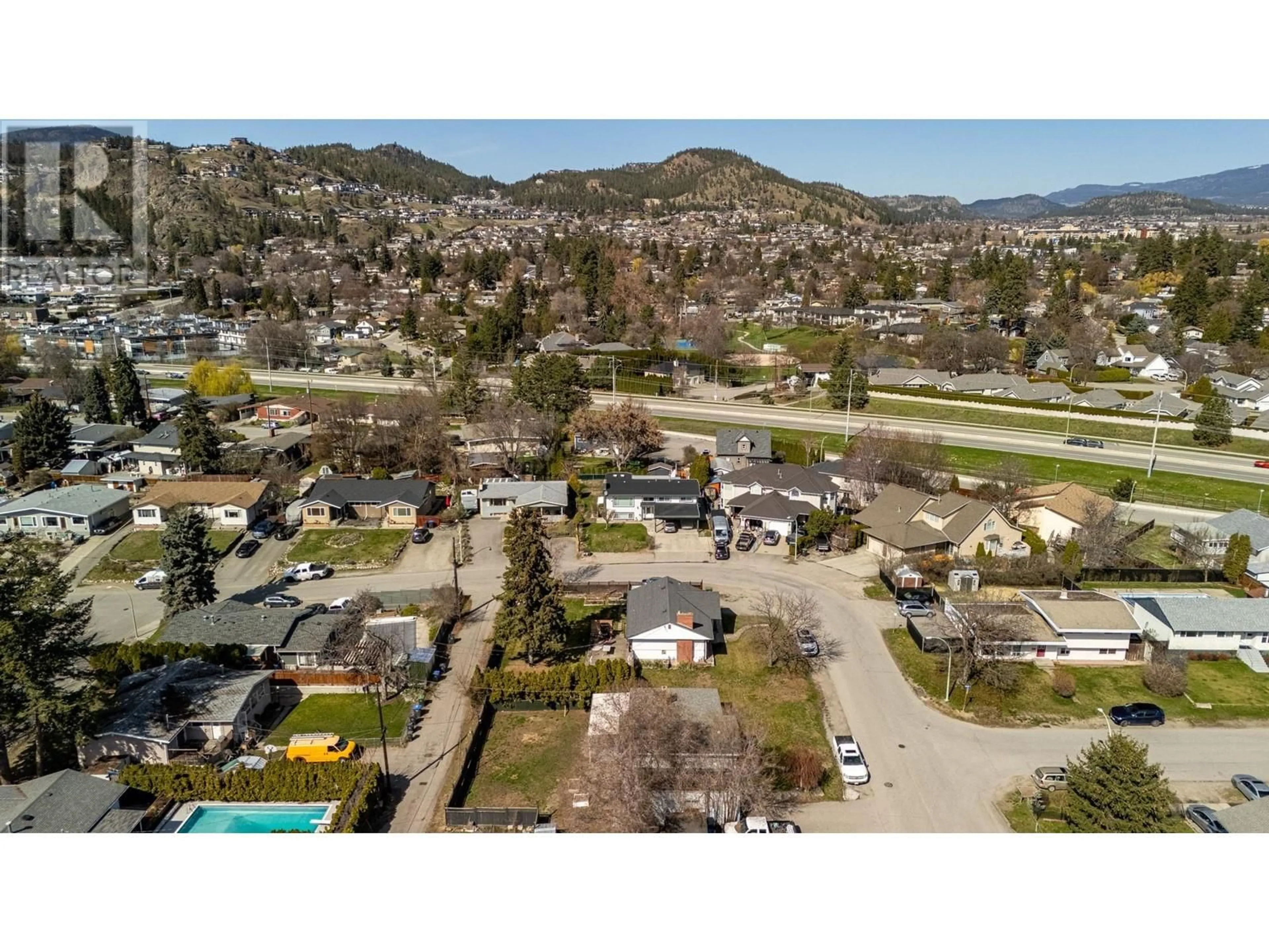 A pic from outside/outdoor area/front of a property/back of a property/a pic from drone, mountain view for 1388 CHERRY CRESCENT WEST, Kelowna British Columbia V1Y3X8