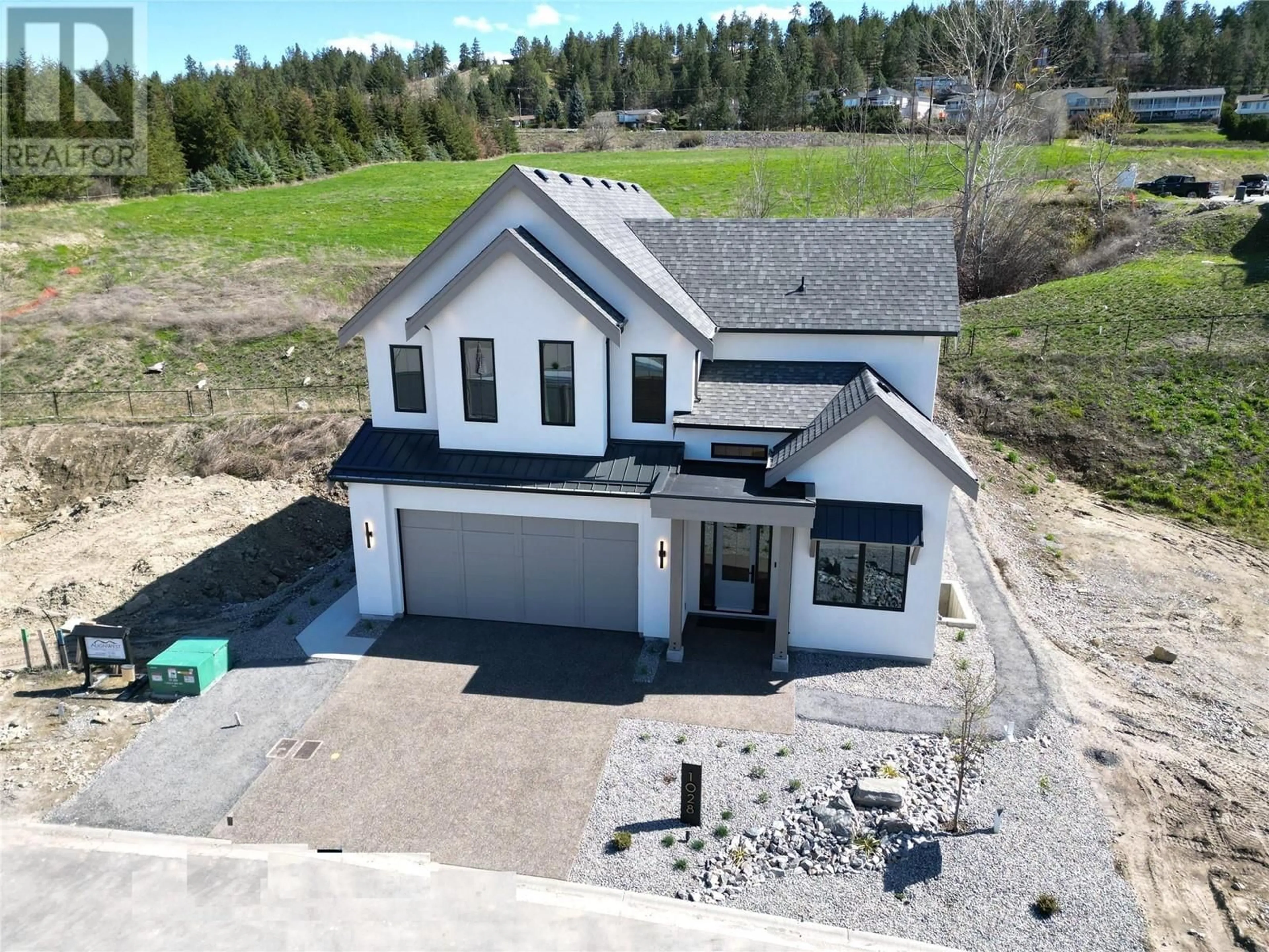 A pic from outside/outdoor area/front of a property/back of a property/a pic from drone, unknown for 1028 BULL CRESCENT, Kelowna British Columbia V1W4N2