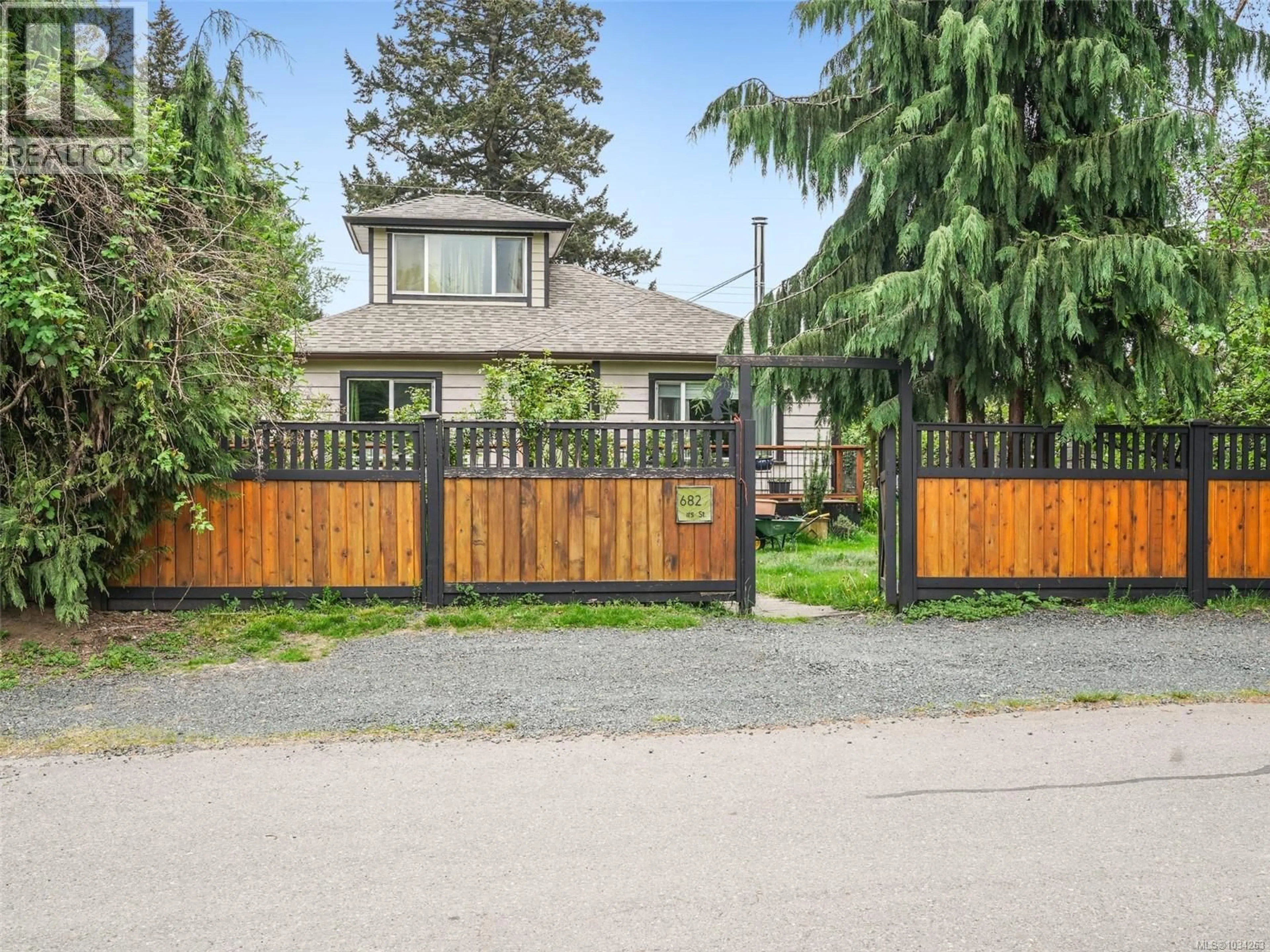 A pic from outside/outdoor area/front of a property/back of a property/a pic from drone, street for 6829 FIRST STREET, Honeymoon Bay British Columbia V0R1Y0