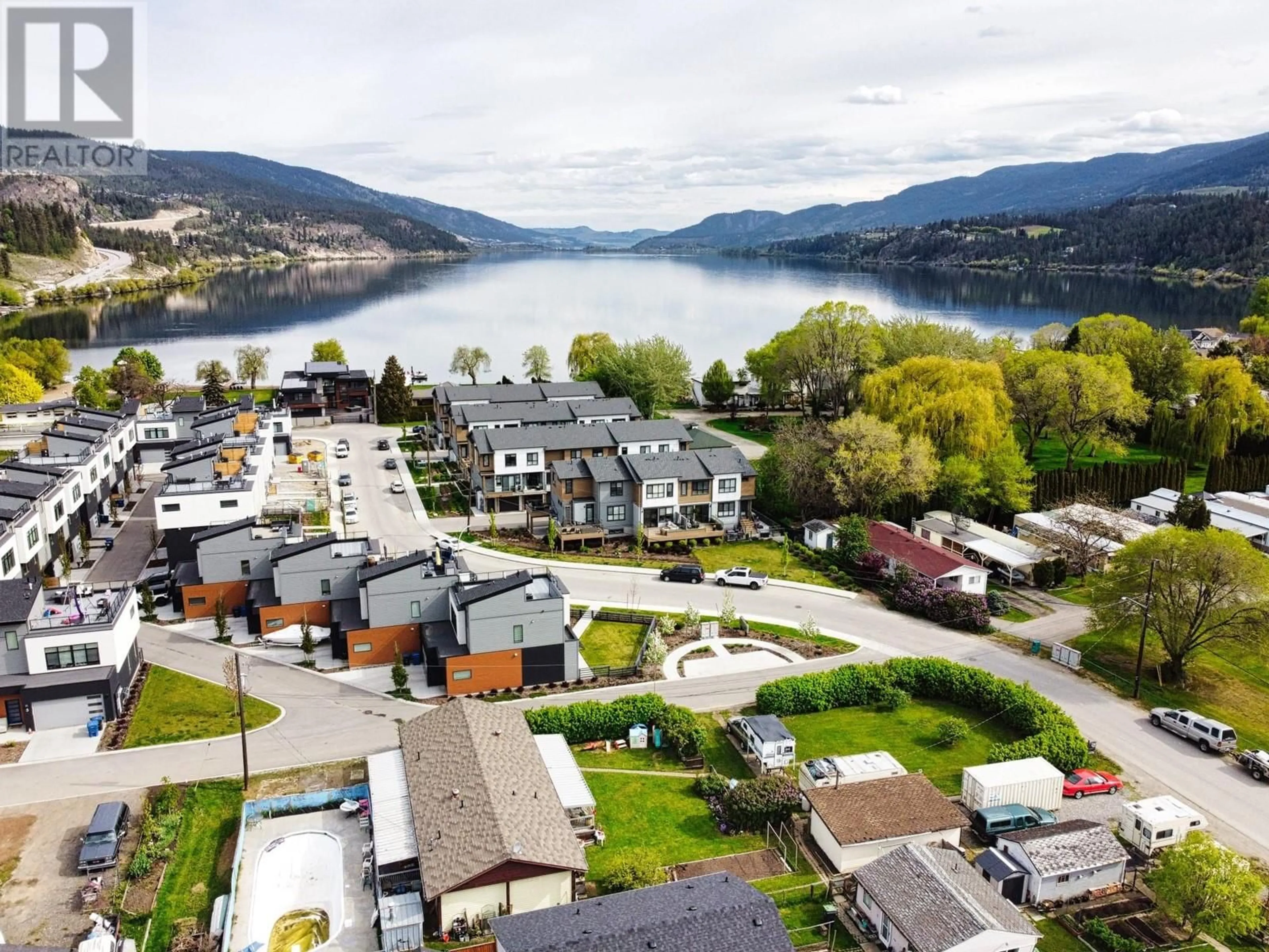 A pic from outside/outdoor area/front of a property/back of a property/a pic from drone, water/lake/river/ocean view for 1 - 11518 ROGERS ROAD, Lake Country British Columbia V4V1X8