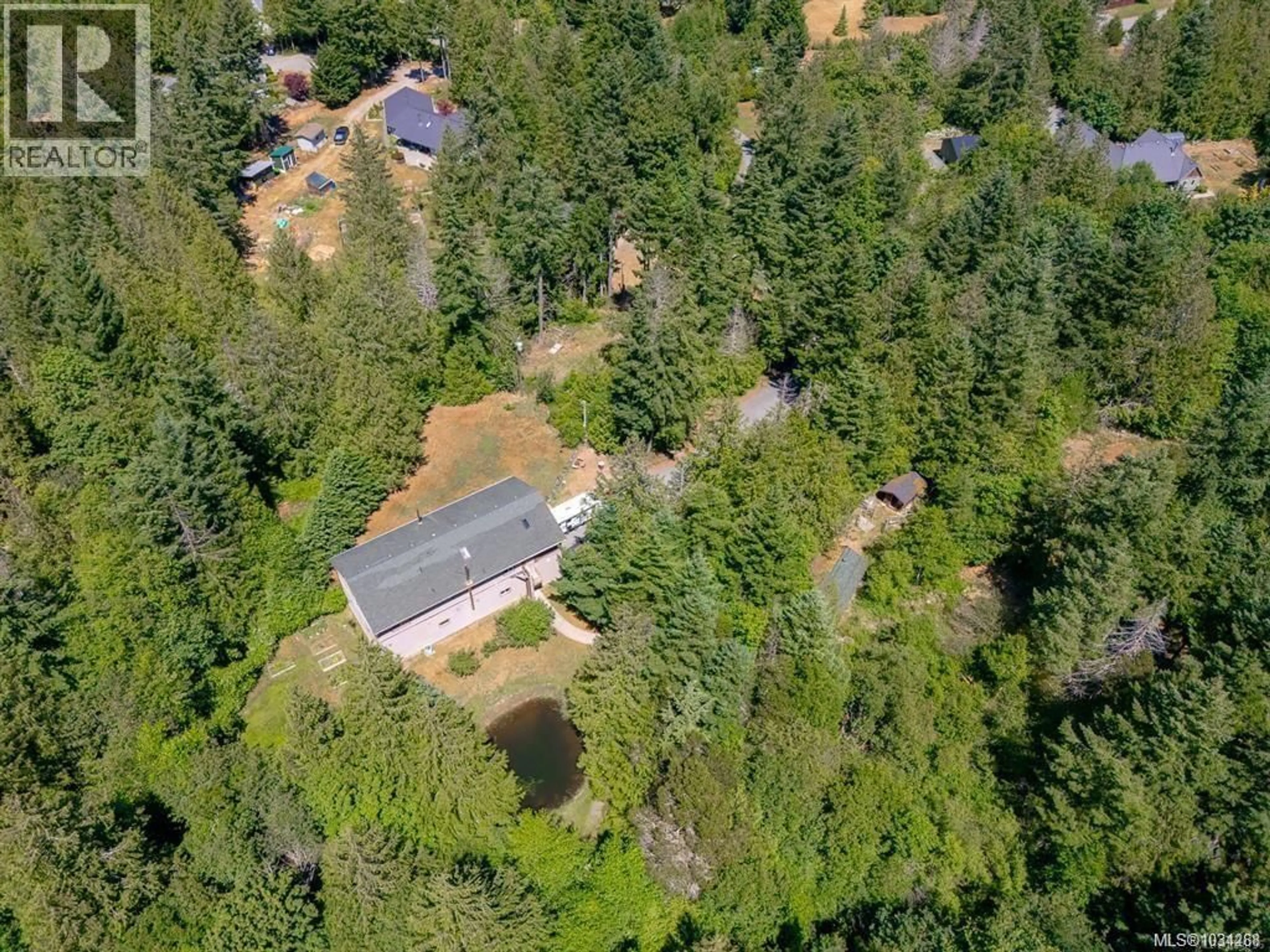 A pic from outside/outdoor area/front of a property/back of a property/a pic from drone, forest/trees view for 1890 PIERCE WAY, Qualicum Beach British Columbia V9K2V1