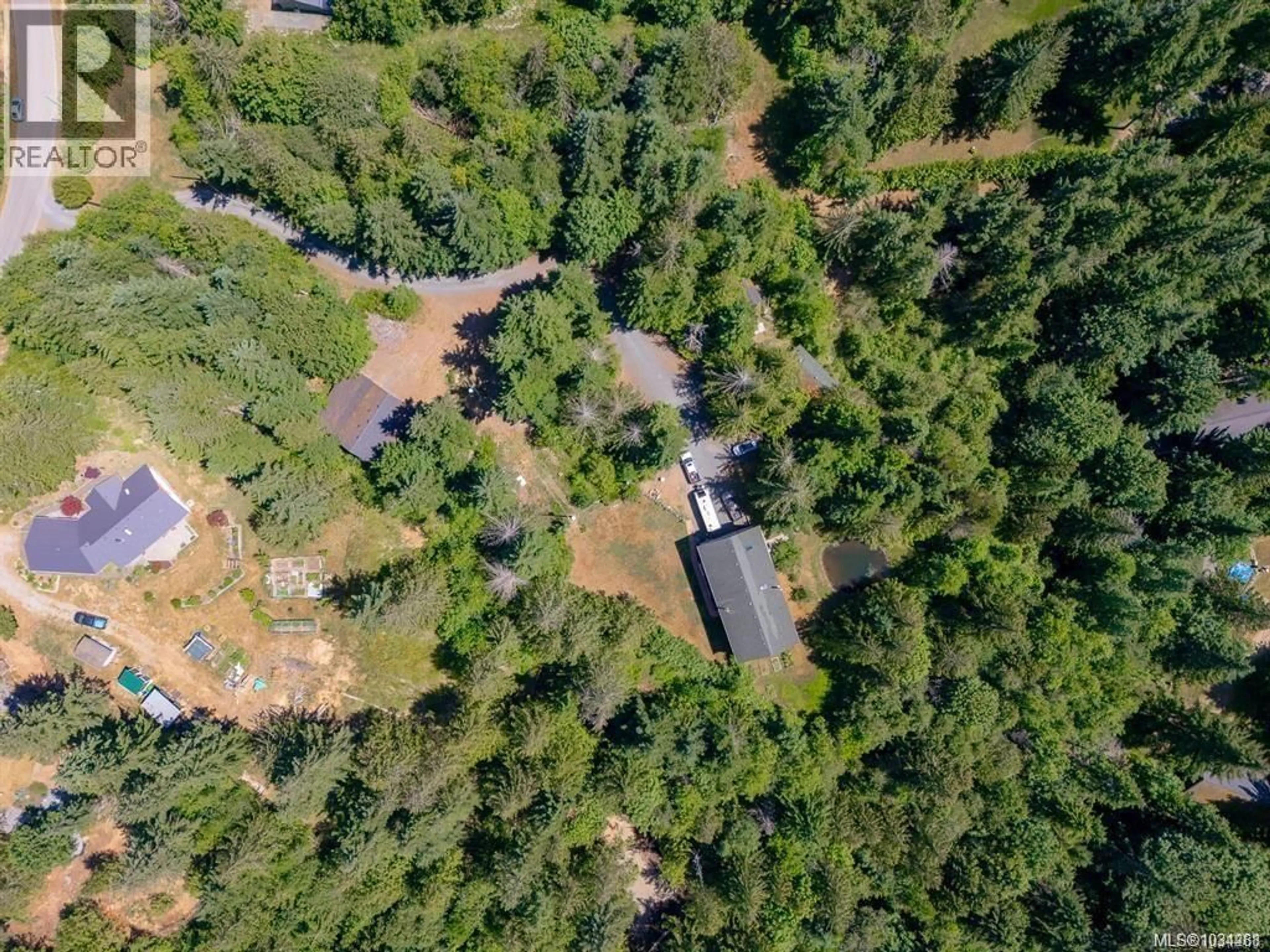 A pic from outside/outdoor area/front of a property/back of a property/a pic from drone, forest/trees view for 1890 PIERCE WAY, Qualicum Beach British Columbia V9K2V1