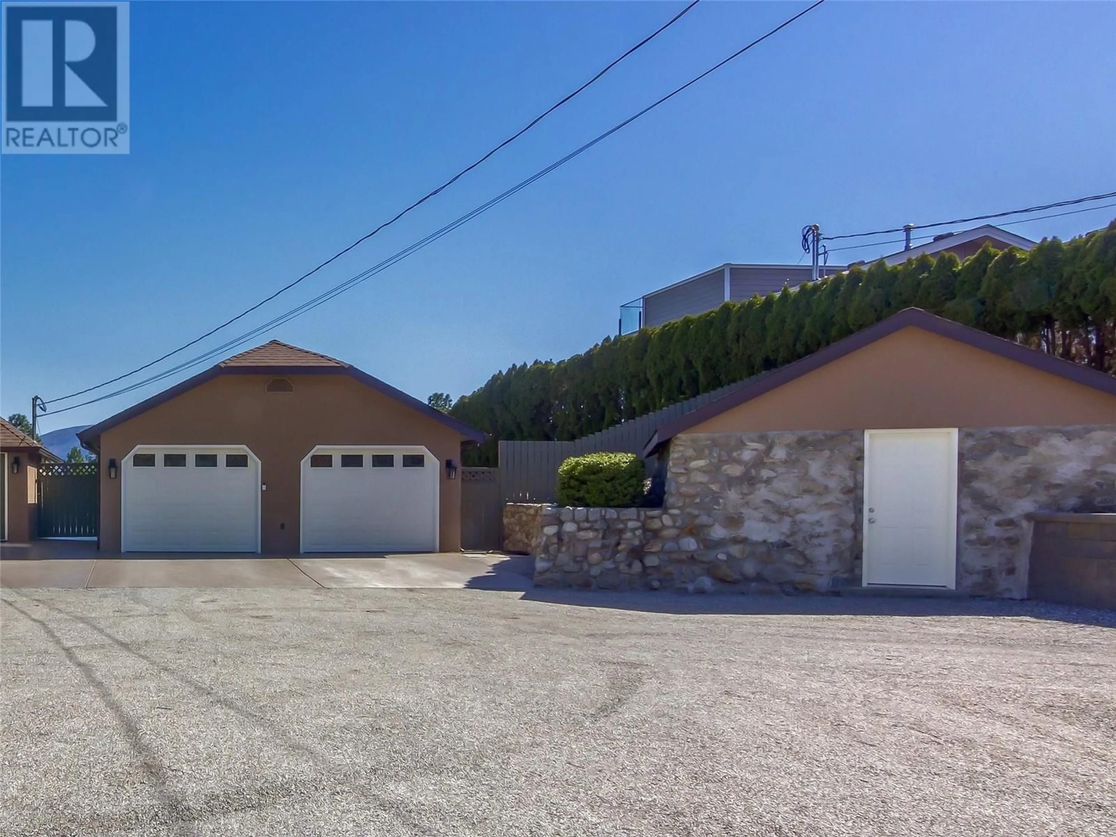 A pic from outside/outdoor area/front of a property/back of a property/a pic from drone, street for 6207 WHINTON CRESCENT, Peachland British Columbia V0H1X7