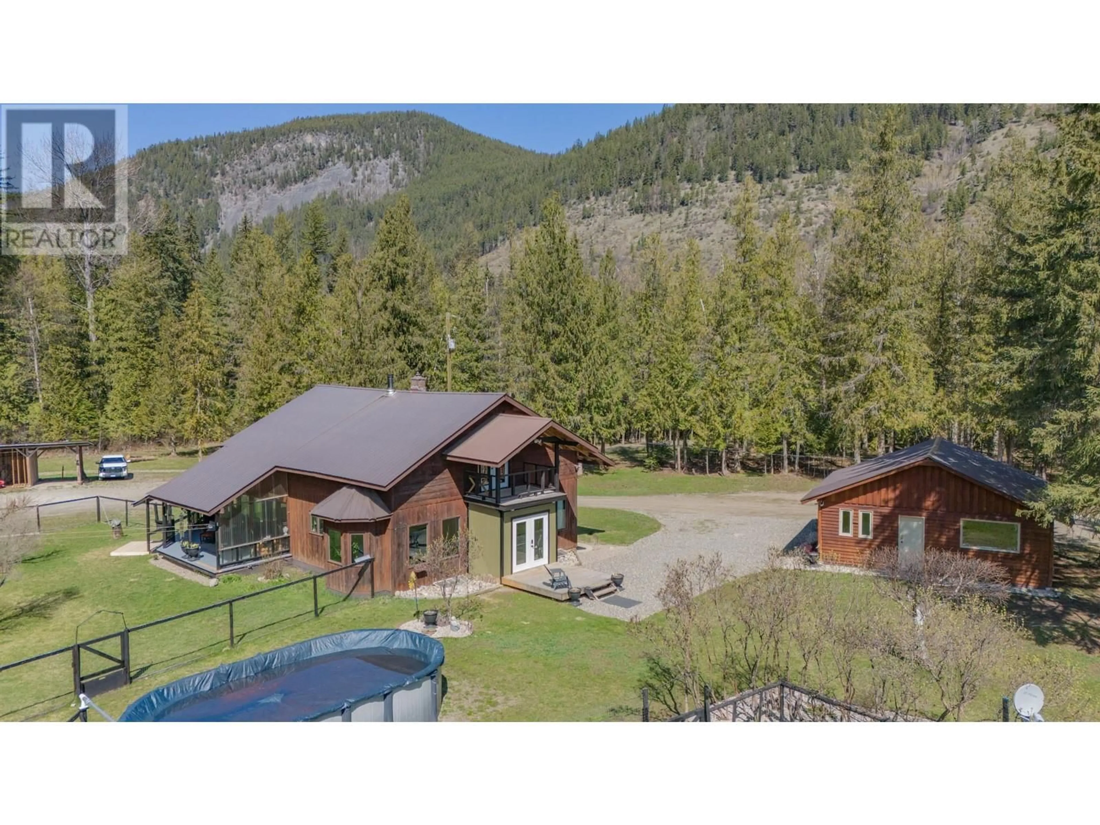 A pic from outside/outdoor area/front of a property/back of a property/a pic from drone, mountain view for 1416 CREIGHTON VALLEY ROAD, Lumby British Columbia V0E2G1