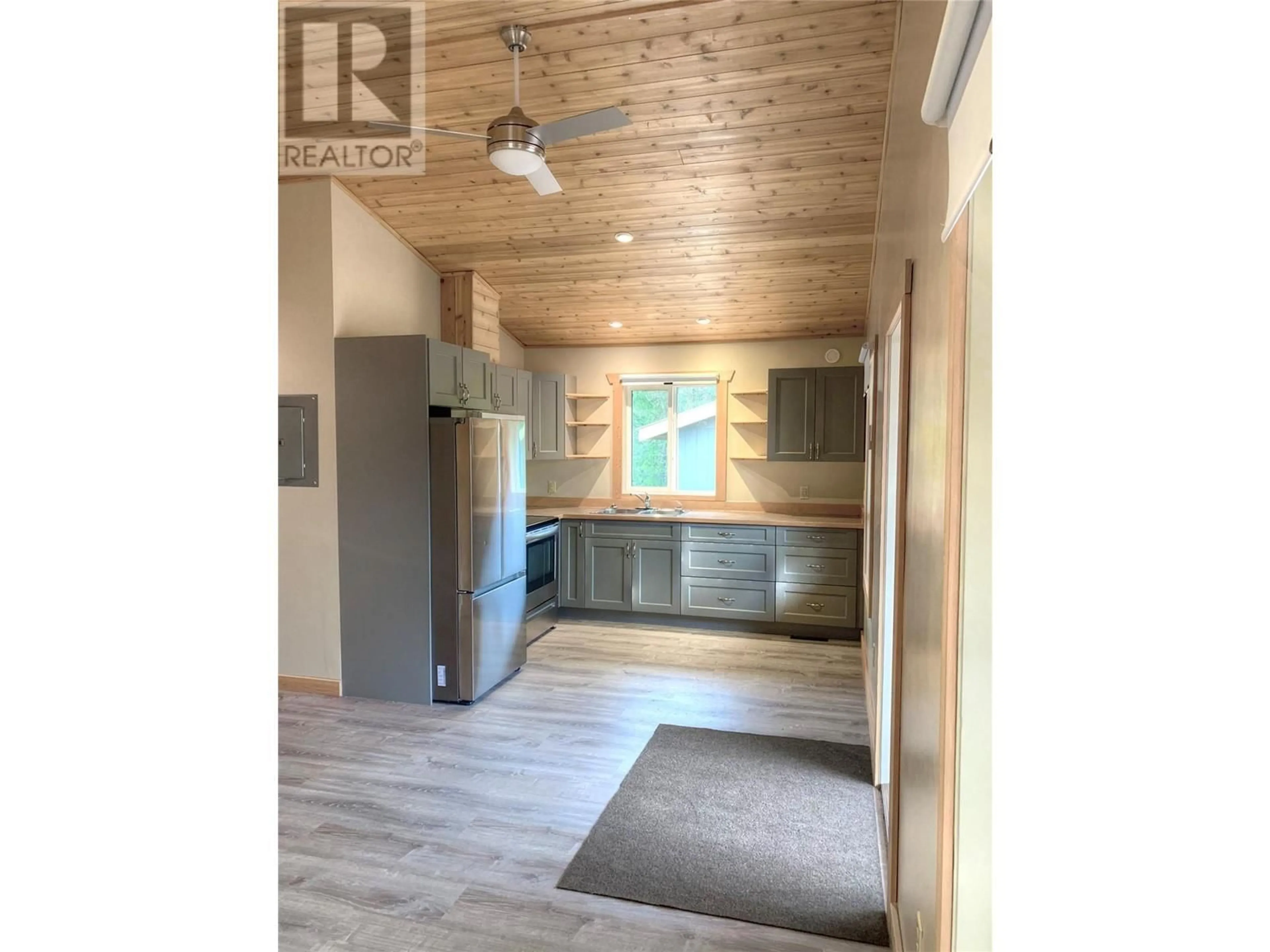 Open concept kitchen, wood/laminate floor for 5541 DUCKSWAY ROAD, Winlaw British Columbia V0G2J0