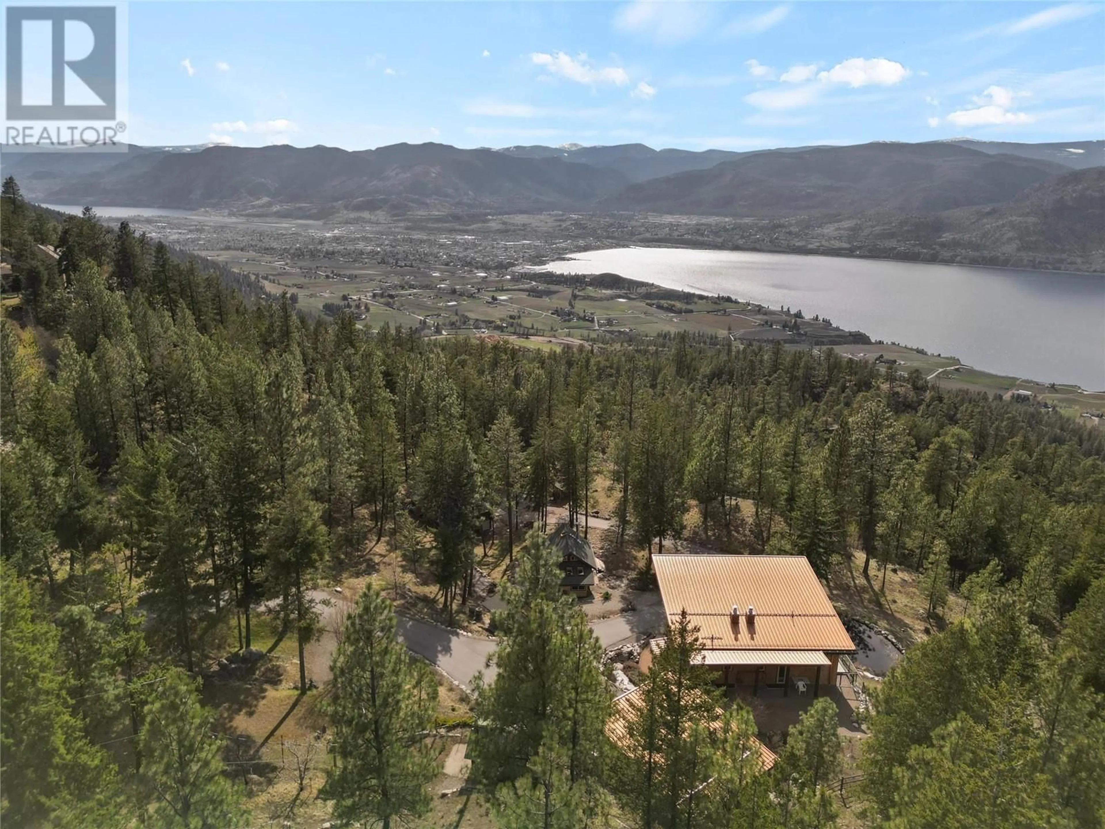 A pic from outside/outdoor area/front of a property/back of a property/a pic from drone, mountain view for 102 VISTA PLACE, Penticton British Columbia V2A8T4
