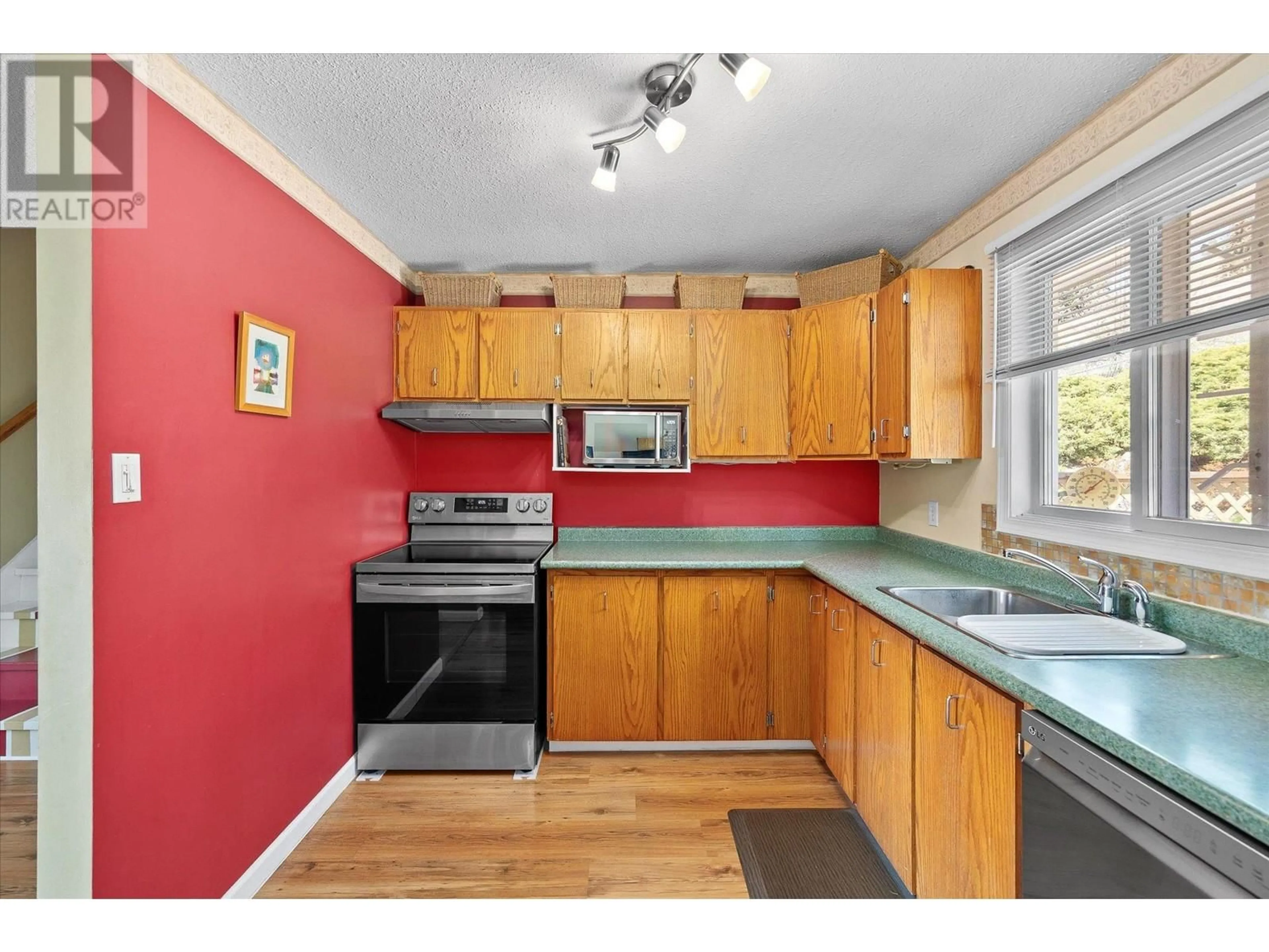 Standard kitchen, wood/laminate floor for 1281 LUND ROAD, Kelowna British Columbia V1P1K9