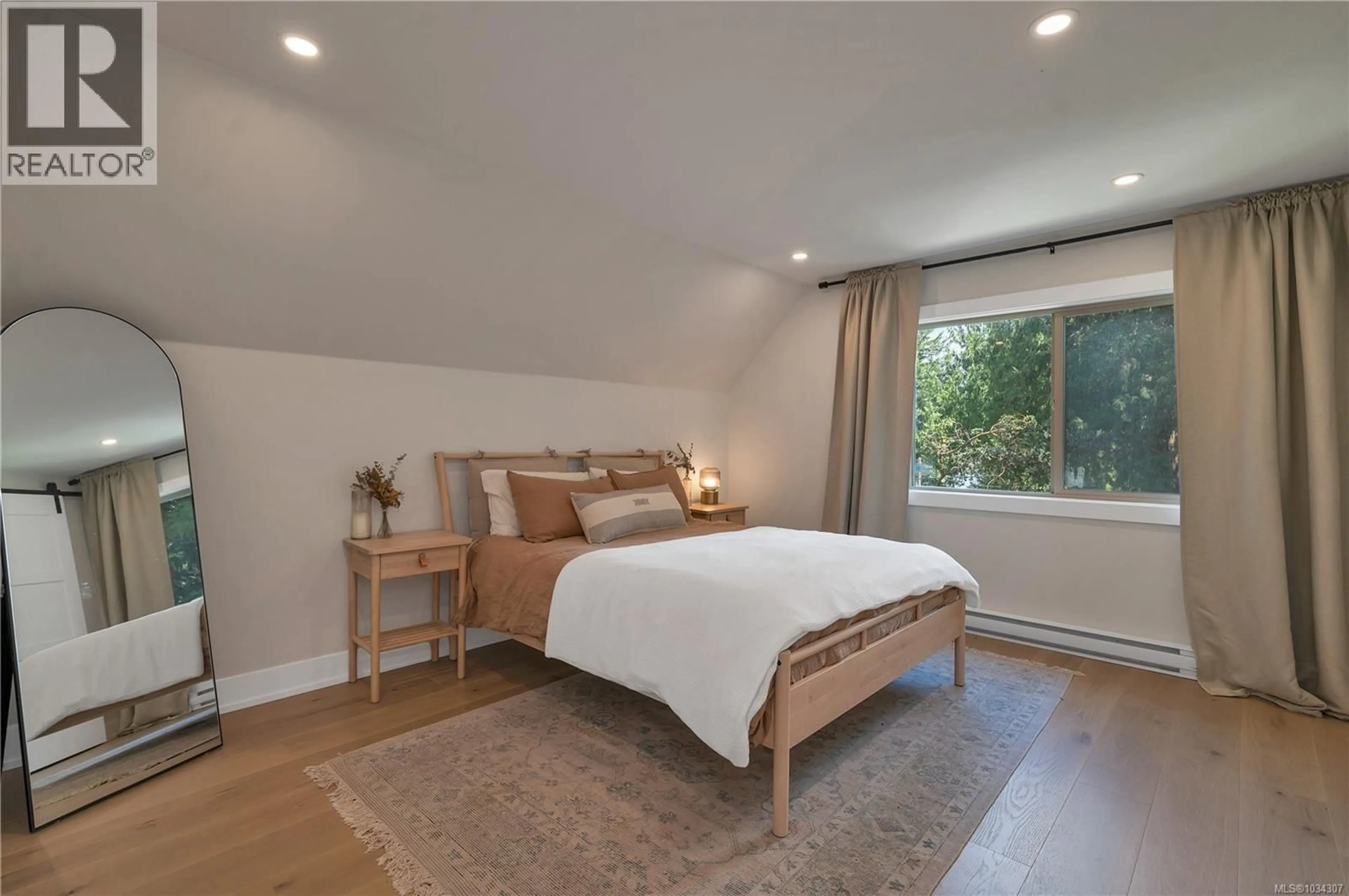 Bedroom with bed, wood/laminate floor for 1387 HERIOT BAY ROAD, Quadra Island British Columbia V0P1H0