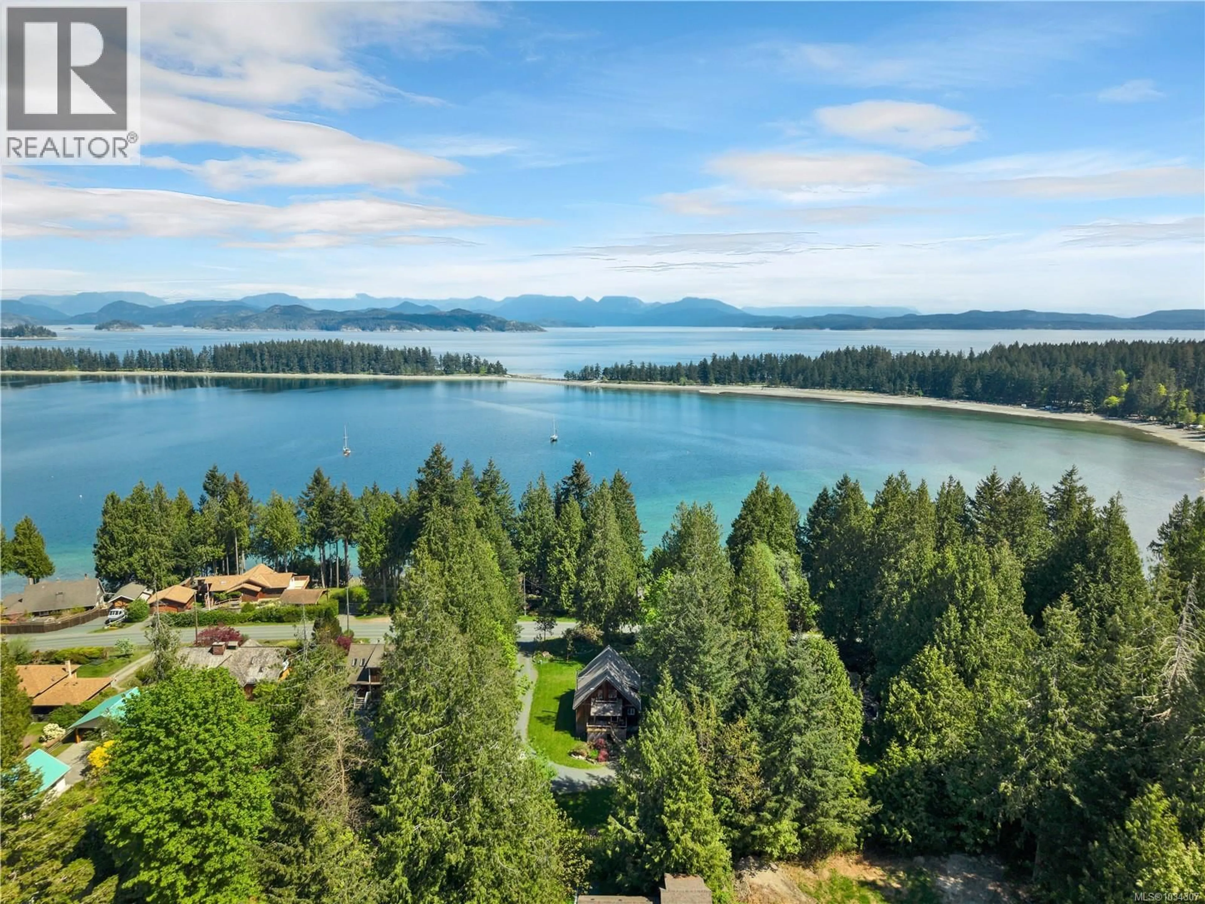 A pic from outside/outdoor area/front of a property/back of a property/a pic from drone, water/lake/river/ocean view for 1387 HERIOT BAY ROAD, Quadra Island British Columbia V0P1H0